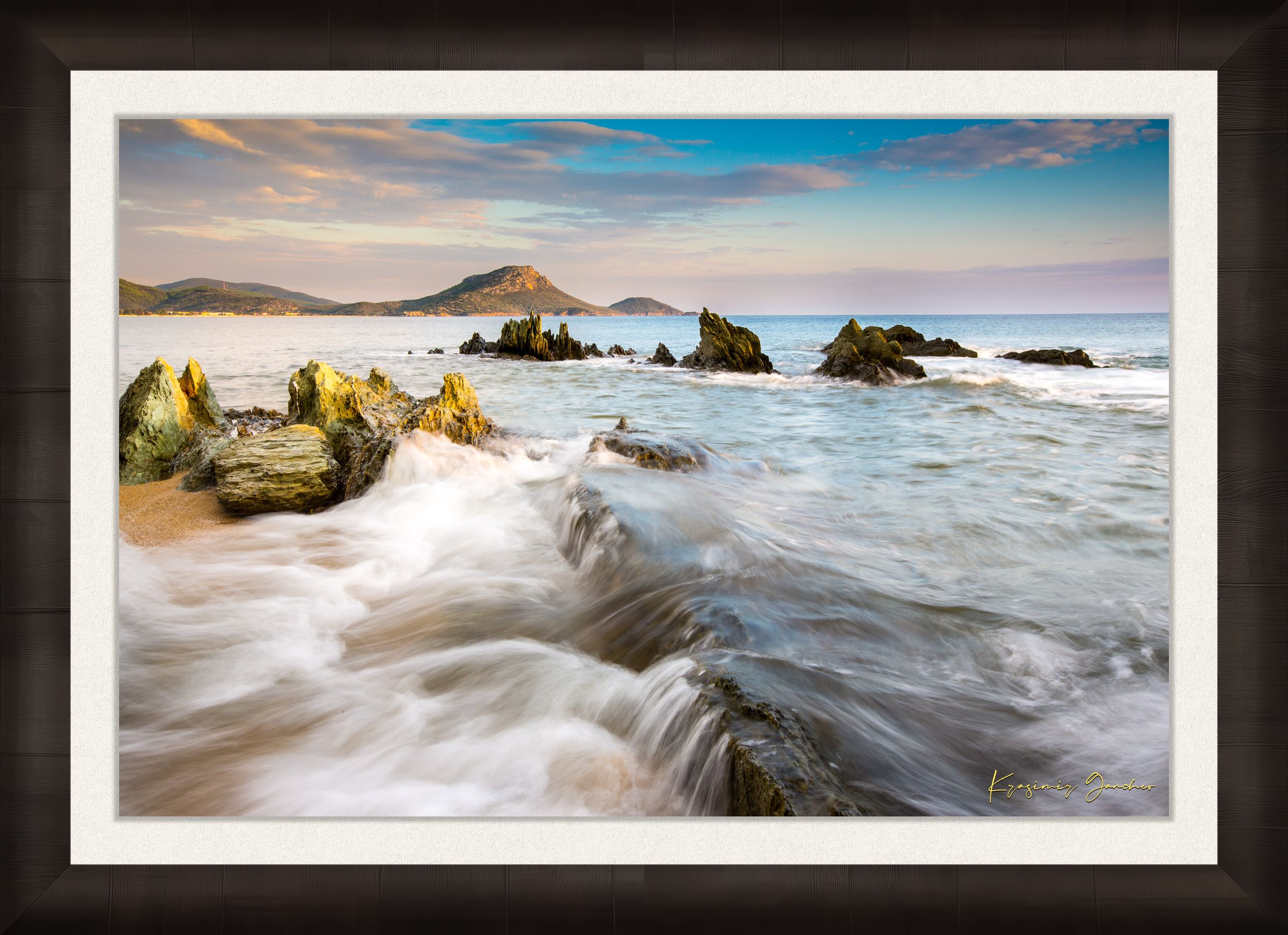 Sunset view of Sithonia's coastline featuring sea, rocky beach, scattered boulders, and gentle waves. #Finish_Roma Dark Ash Frame & Bright Liner