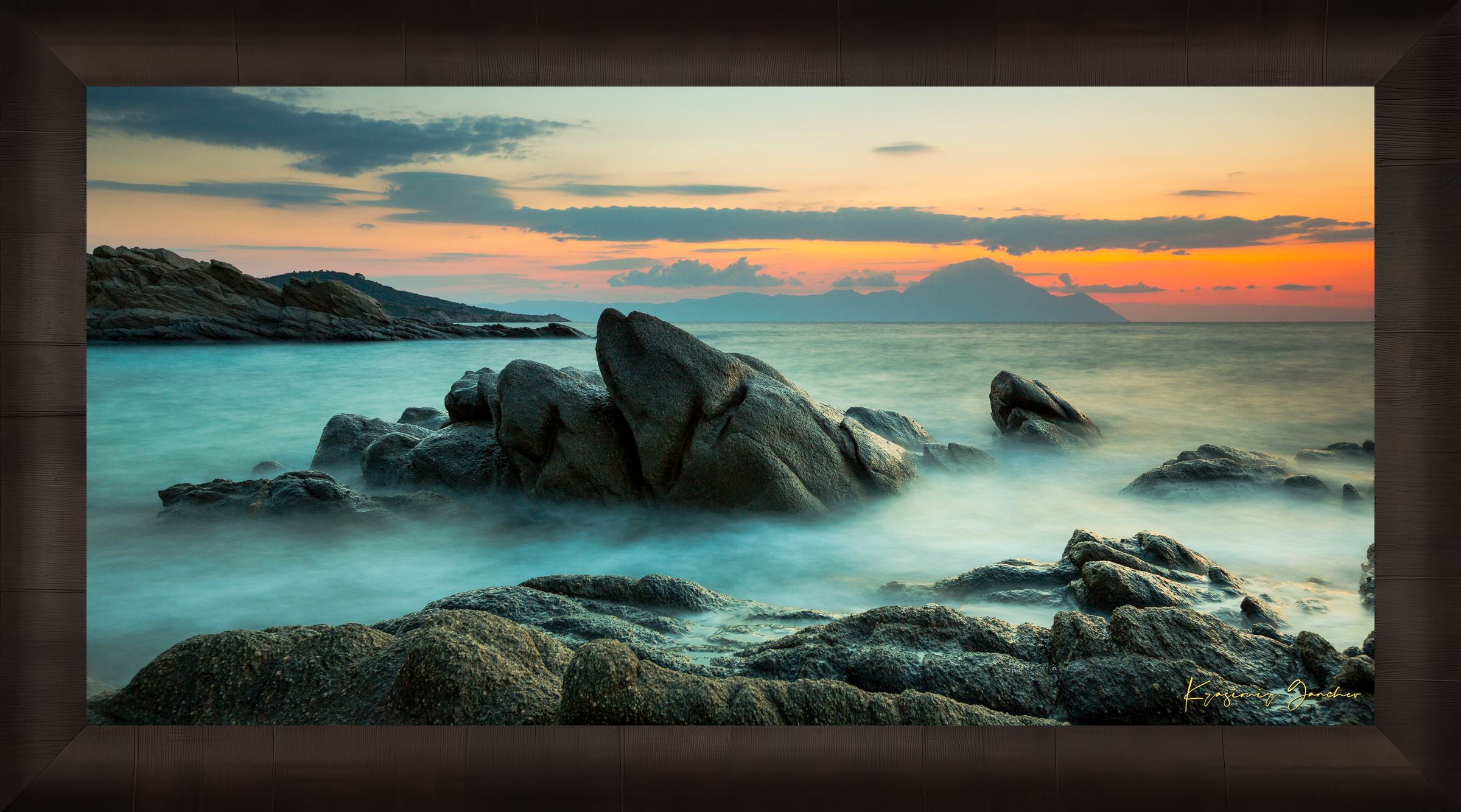 Sunrise long exposure at Sarti featuring coastal rock formations, sea stacks, cloud-covered sky, and soft waves. #Finish_Roma Dark Ash Frame