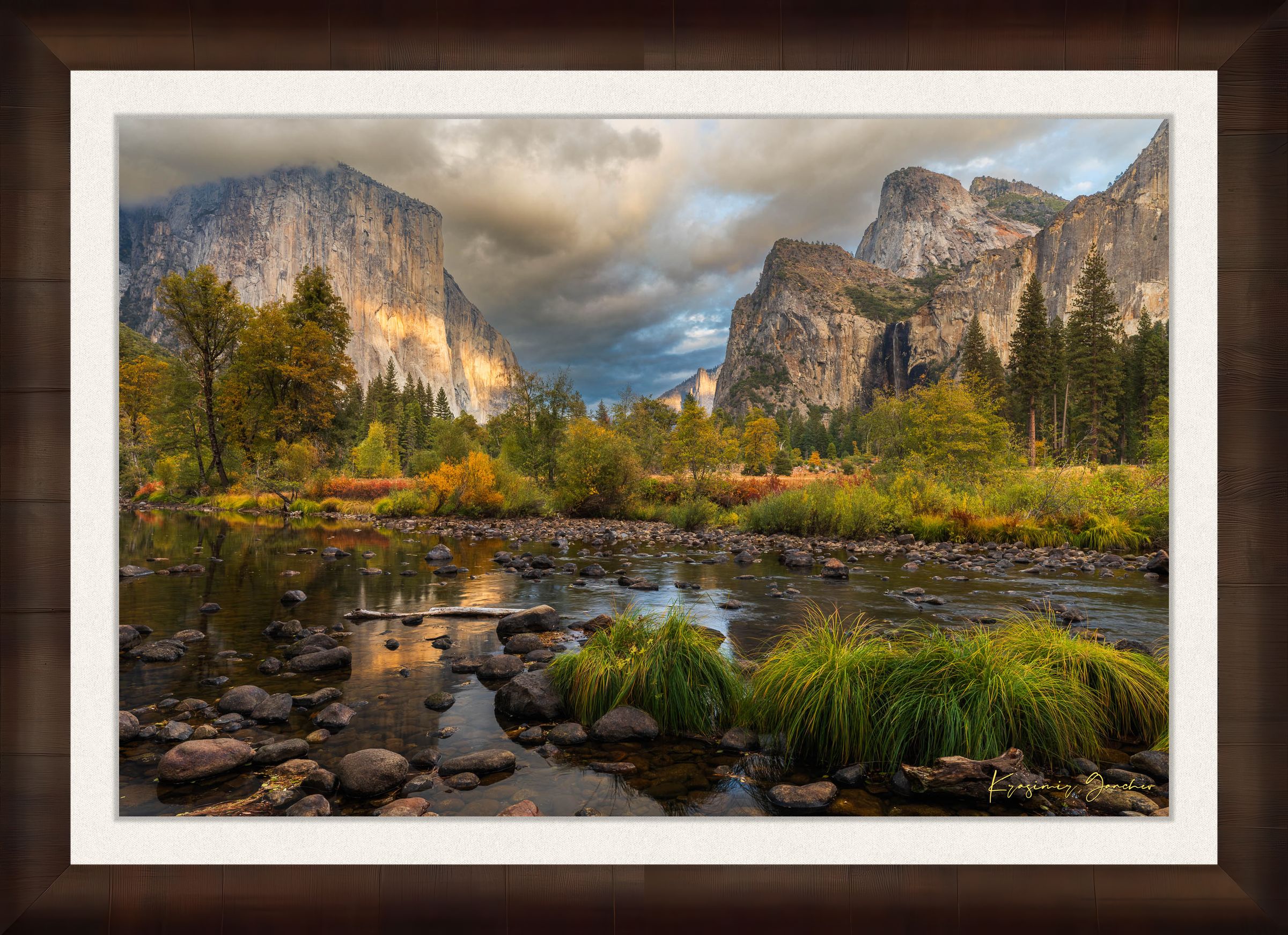 El Capitan at sunset in Yosemite Valley, golden light reflecting off the river amid clouds and seasonal tree colors. #Finish_Roma Cigar Leaf Frame & Bright Liner