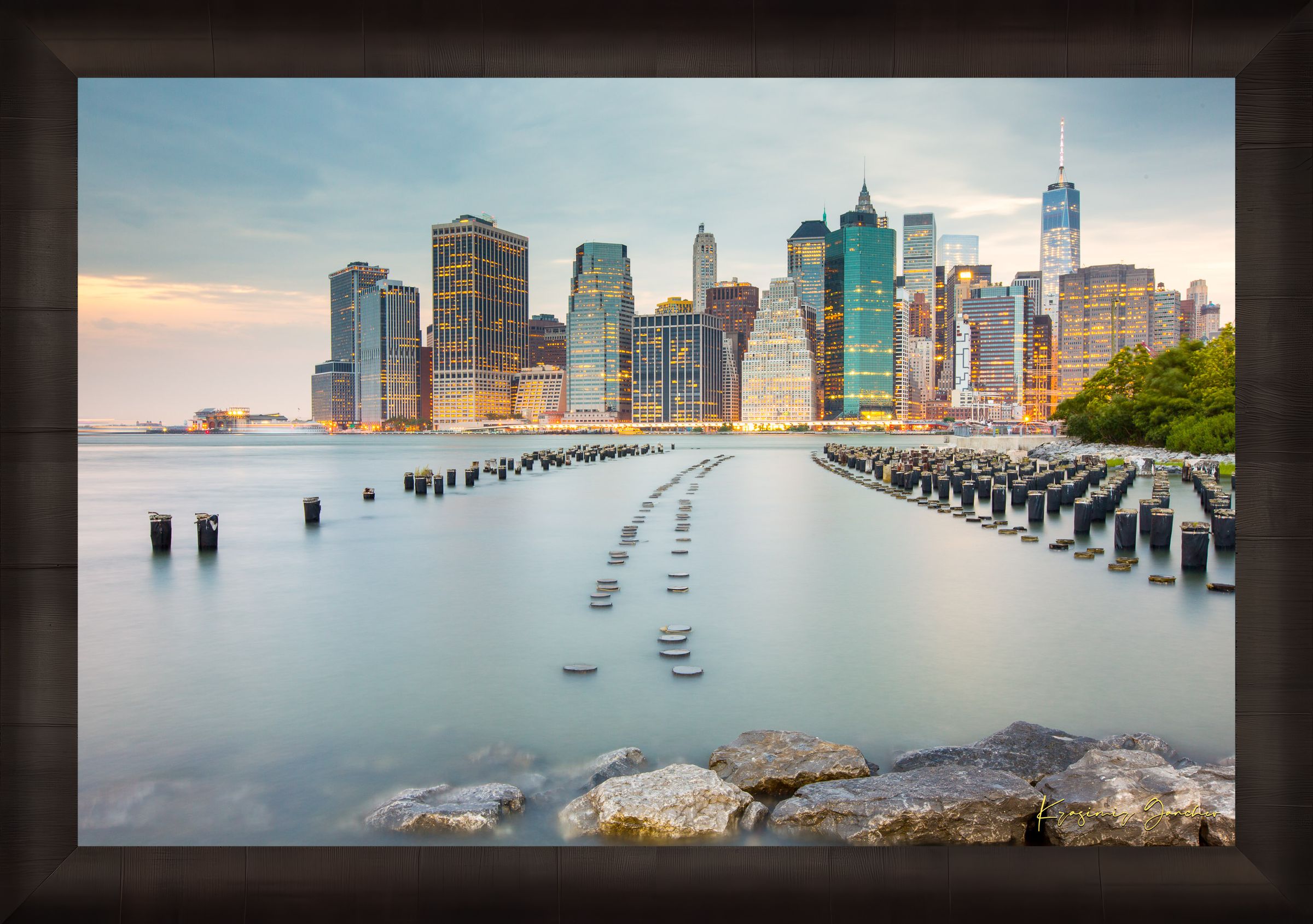 Urban waterfront scene along an estuary in Manhattan under a twilight sky with clouds and reflected city lights. #Finish_Roma Dark Ash Frame