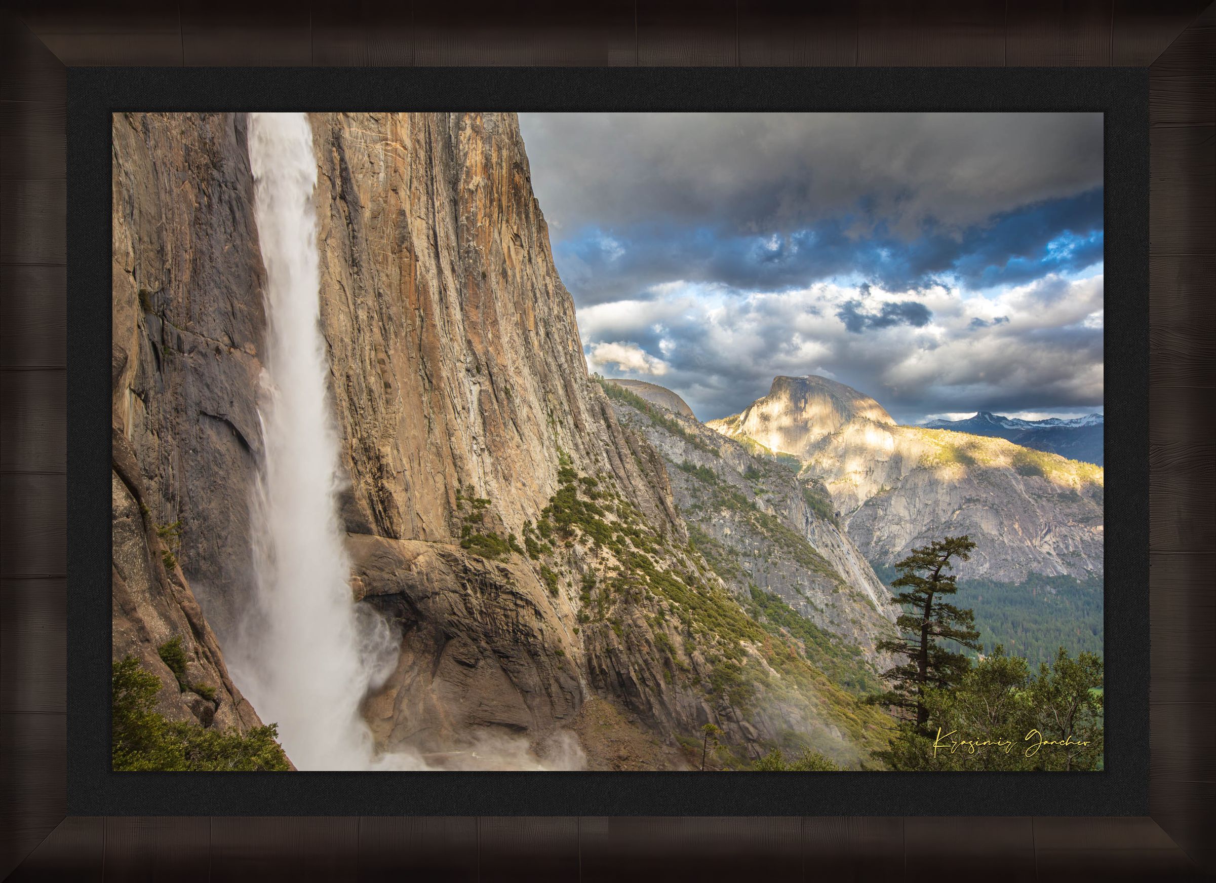 Half Dome illuminated by sunset light through dense storm clouds with waterfall below. #Finish_Roma Dark Ash Frame & Dark Liner