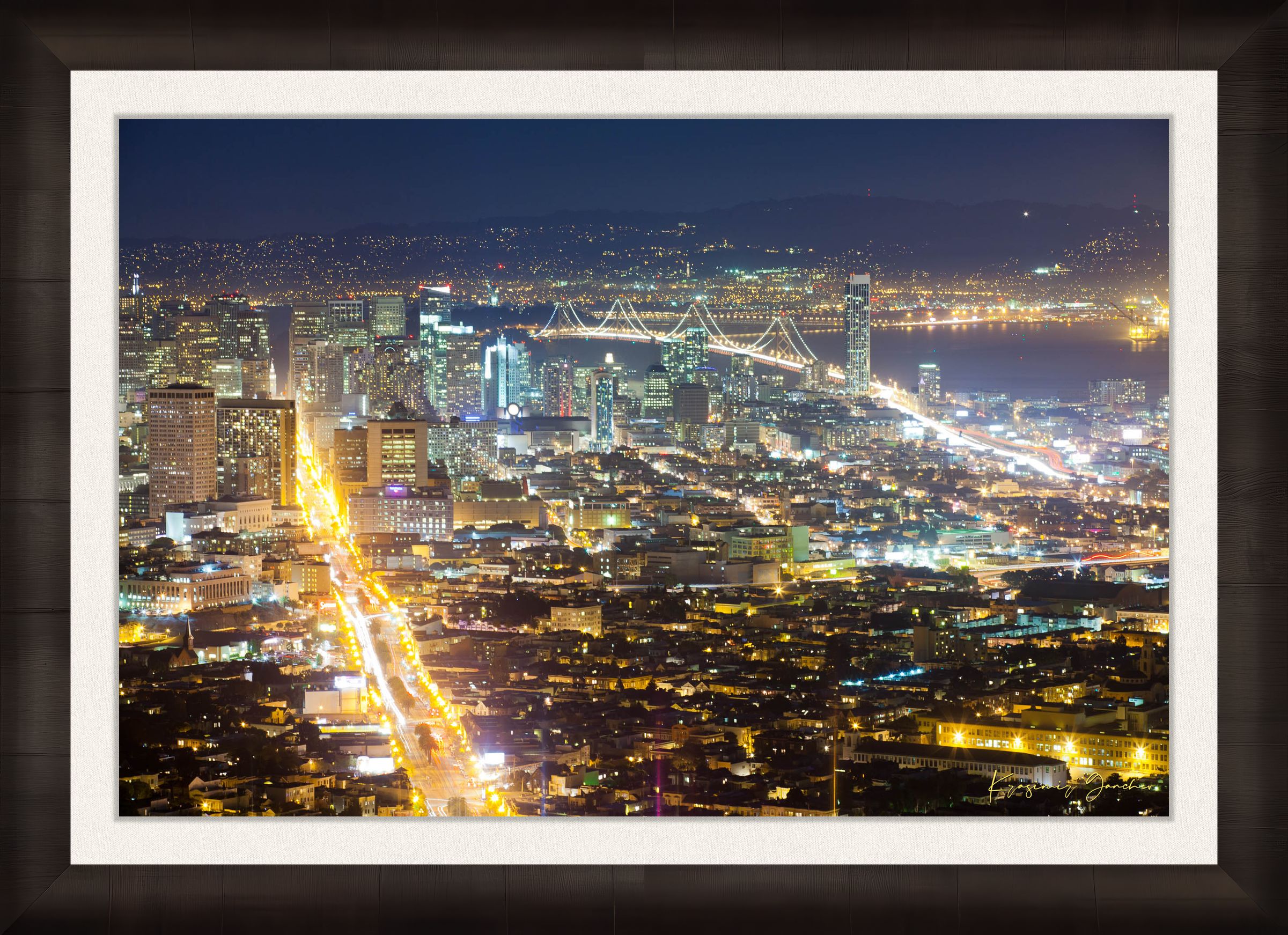 Nighttime panoramic view from Twin Peaks, San Francisco, with illuminated city lights reflected on the bay through a layer of mist. #Finish_Roma Dark Ash Frame & Bright Liner