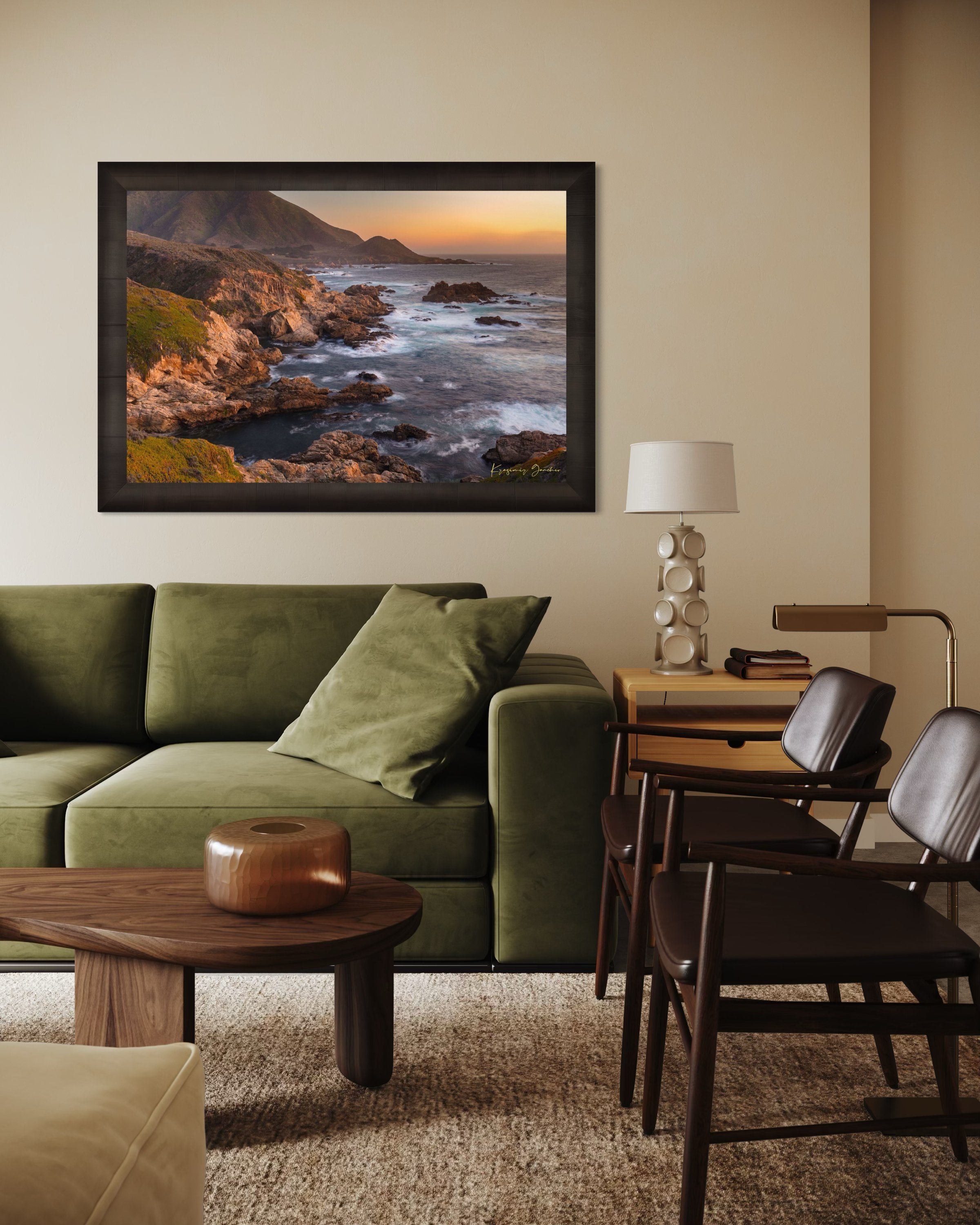 Rugged coastline of Big Sur featuring dark boulder formations, green slopes, ocean waves, and soft sunset glow across land and sea. #Finish_Roma Dark Ash Frame