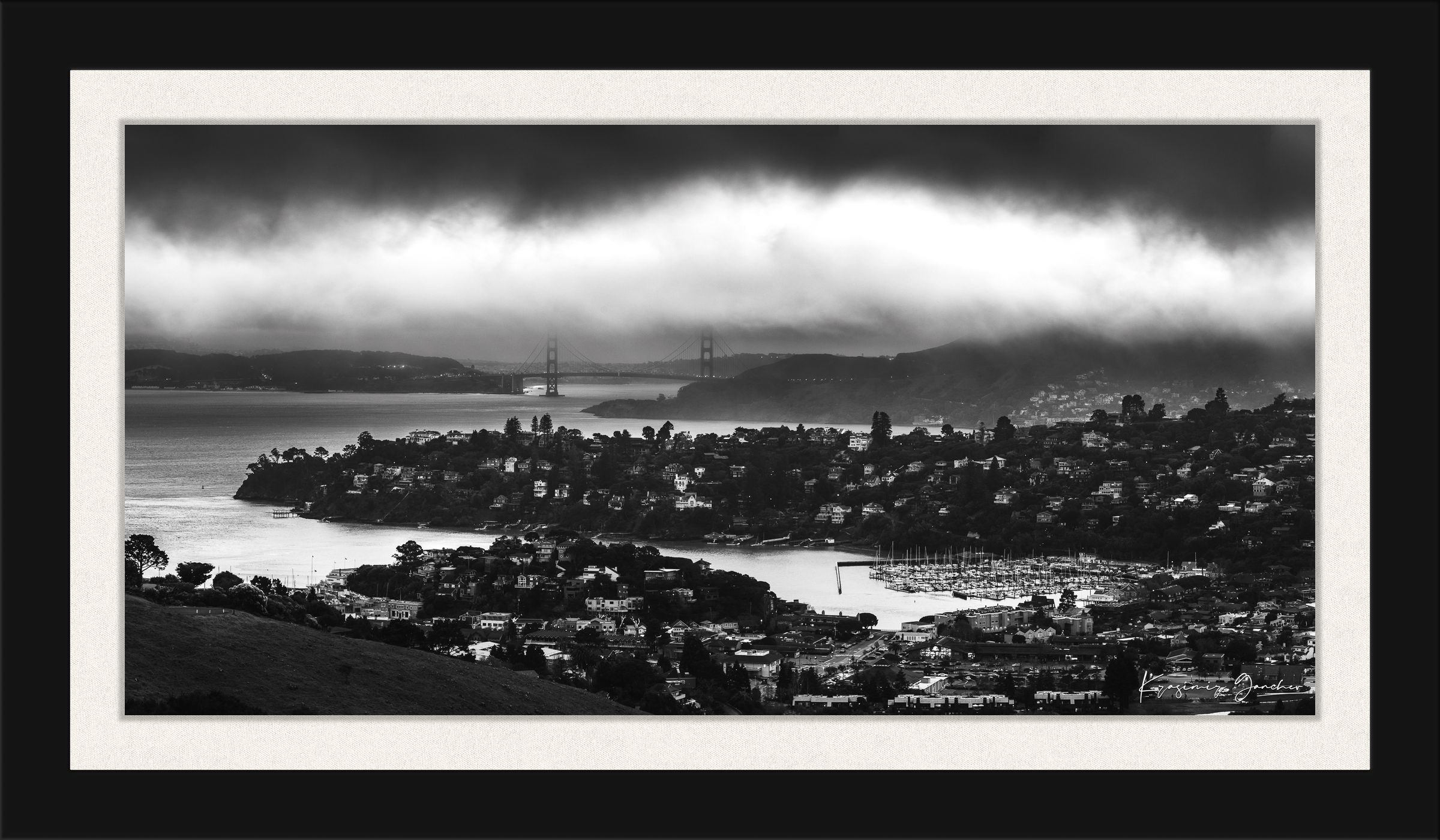 Golden Gate Bridge visible through fog at dusk above the San Francisco Bay with Tiburon cityscape in foreground. #Finish_Roma Satin Black Frame & Bright Liner