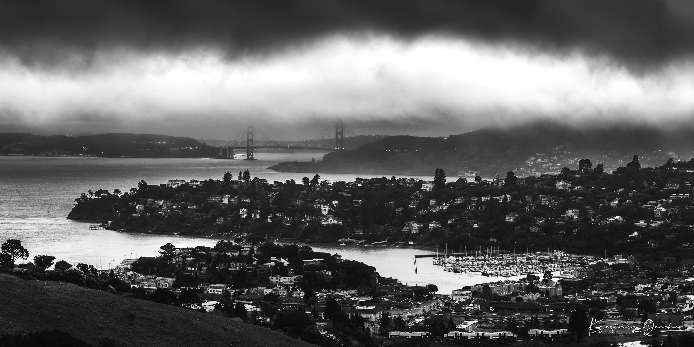 Golden Gate Bridge visible through fog at dusk above the San Francisco Bay with Tiburon cityscape in foreground. #Finish_Acrylic Recess