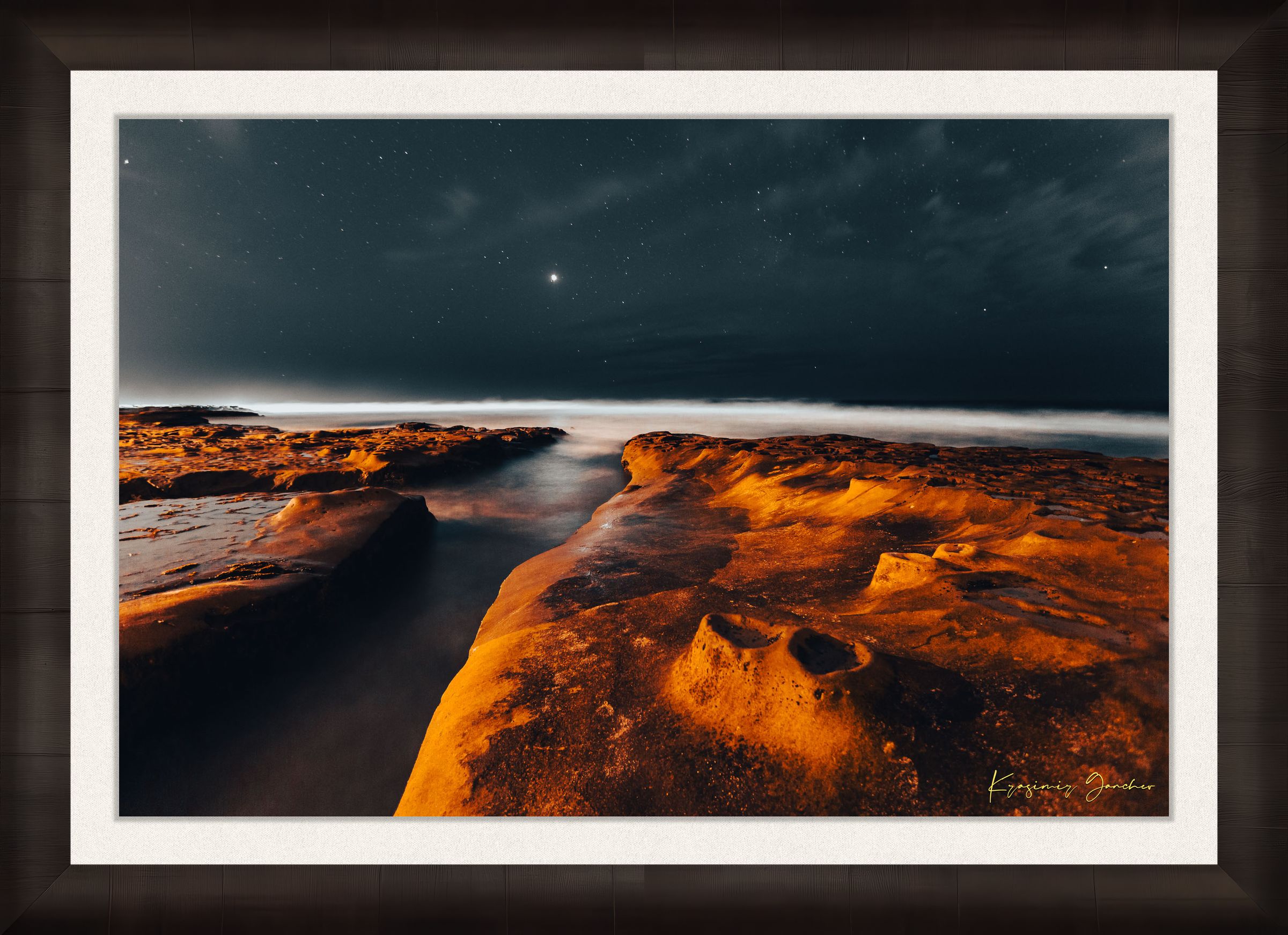 Nighttime La Jolla coastal scene showing tide pools under a starry sky with reflective ocean surface mirroring the stars. #Finish_Roma Dark Ash Frame & Bright Liner