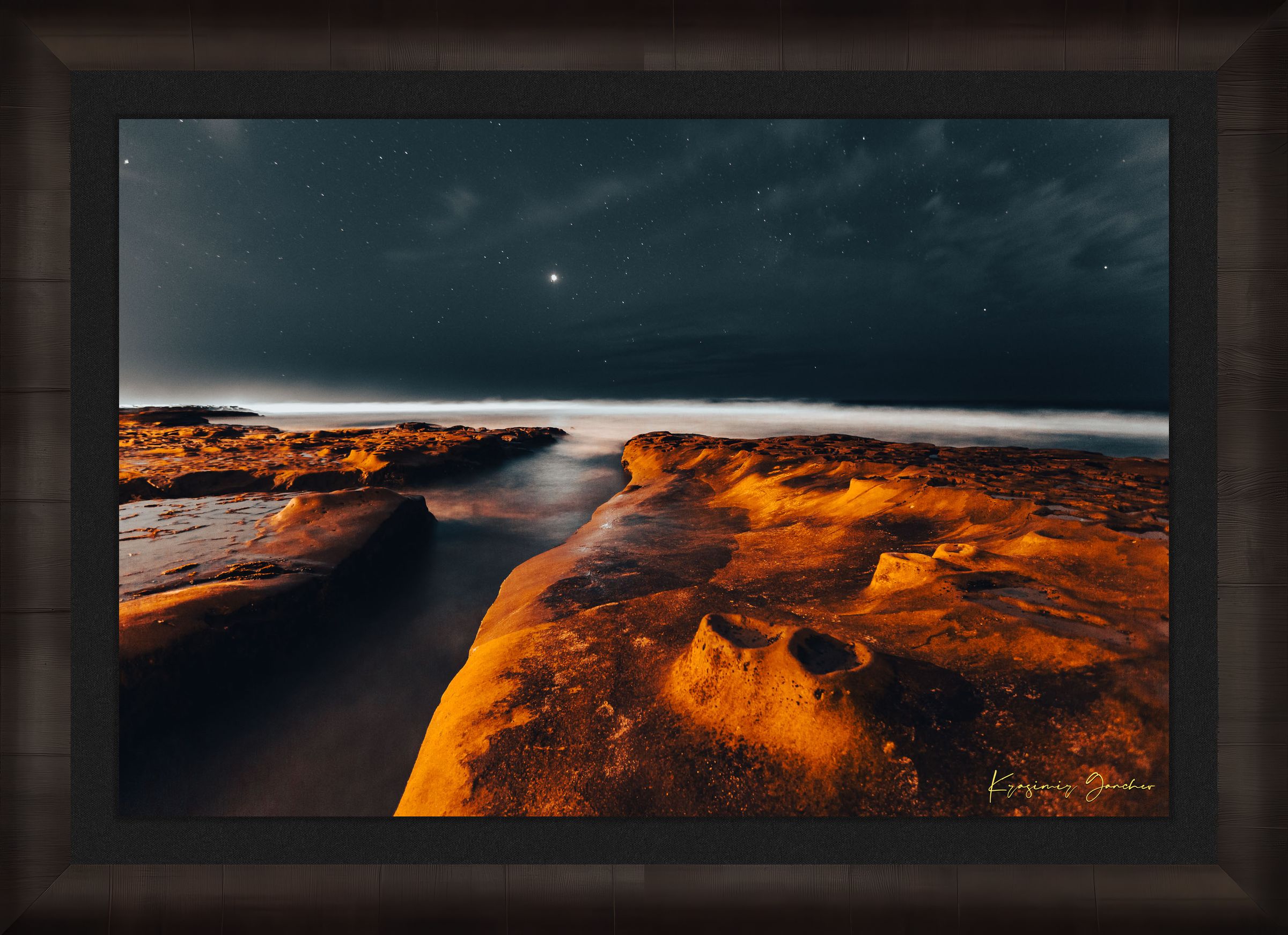 Nighttime La Jolla coastal scene showing tide pools under a starry sky with reflective ocean surface mirroring the stars. #Finish_Roma Dark Ash Frame & Dark Liner