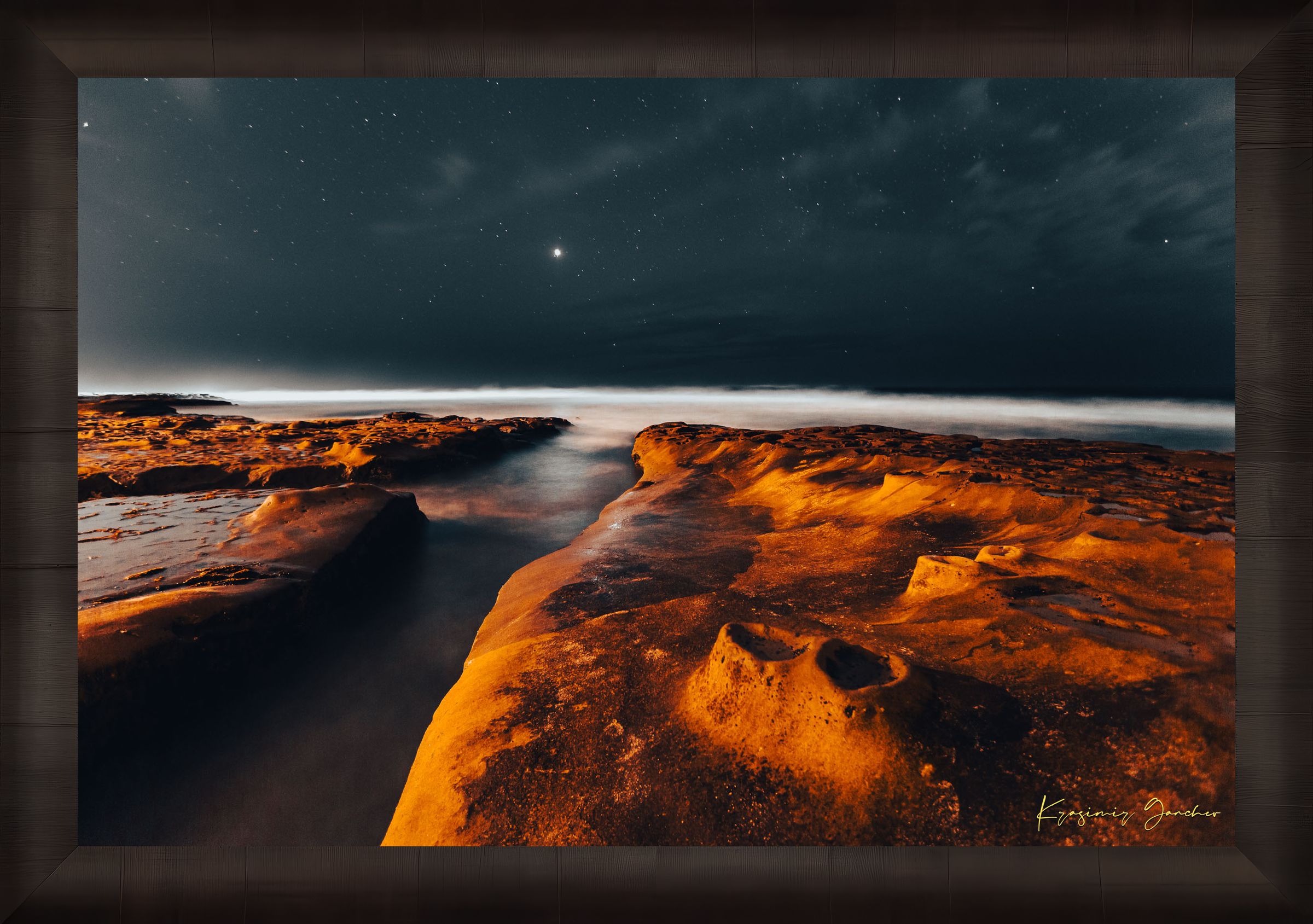Nighttime La Jolla coastal scene showing tide pools under a starry sky with reflective ocean surface mirroring the stars. #Finish_Roma Dark Ash Frame