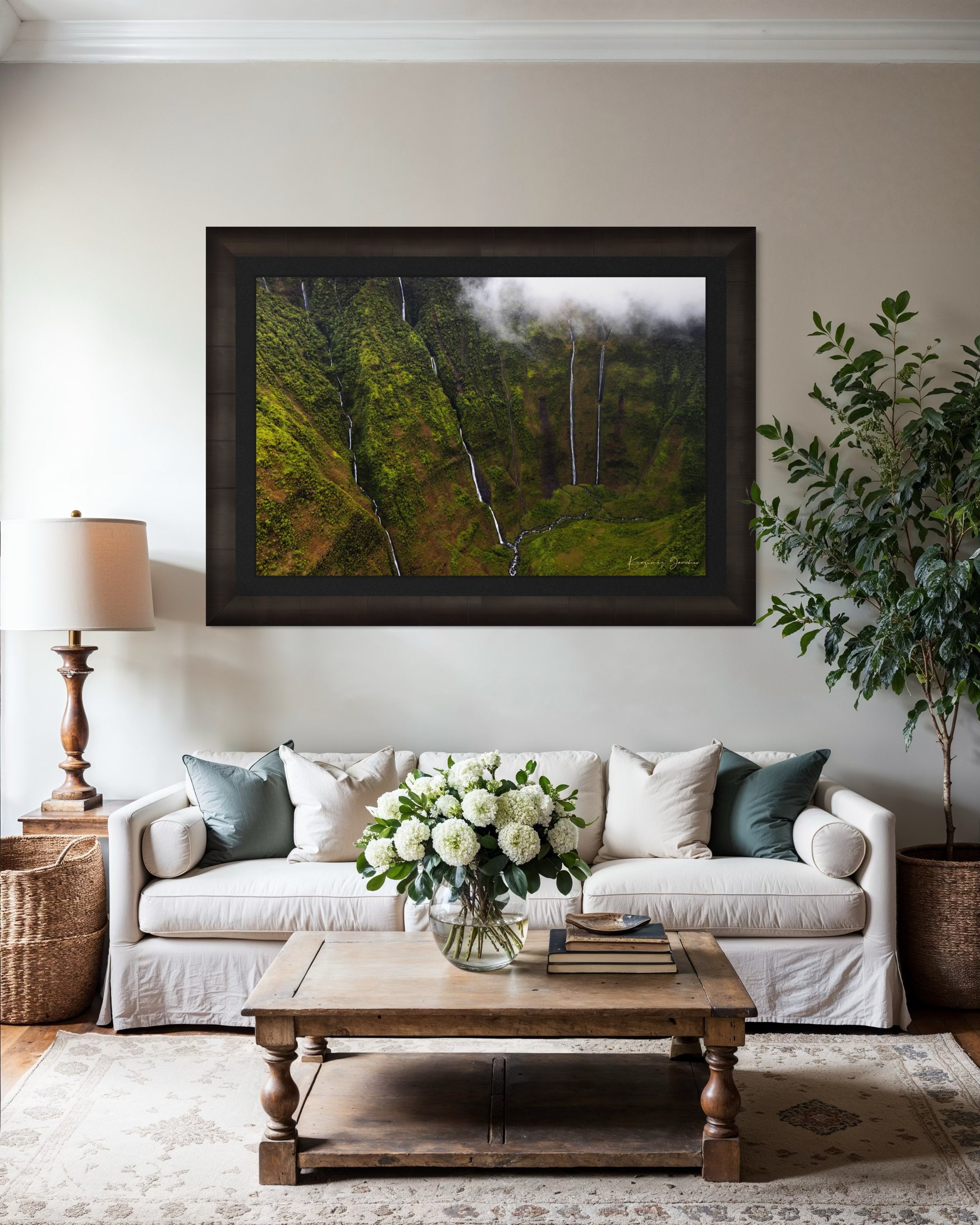 Waterfall cascading down a cliff in the Weeping Wall region, Kauai, under daytime light and cloud cover. #Finish_Roma Dark Ash Frame & Dark Liner