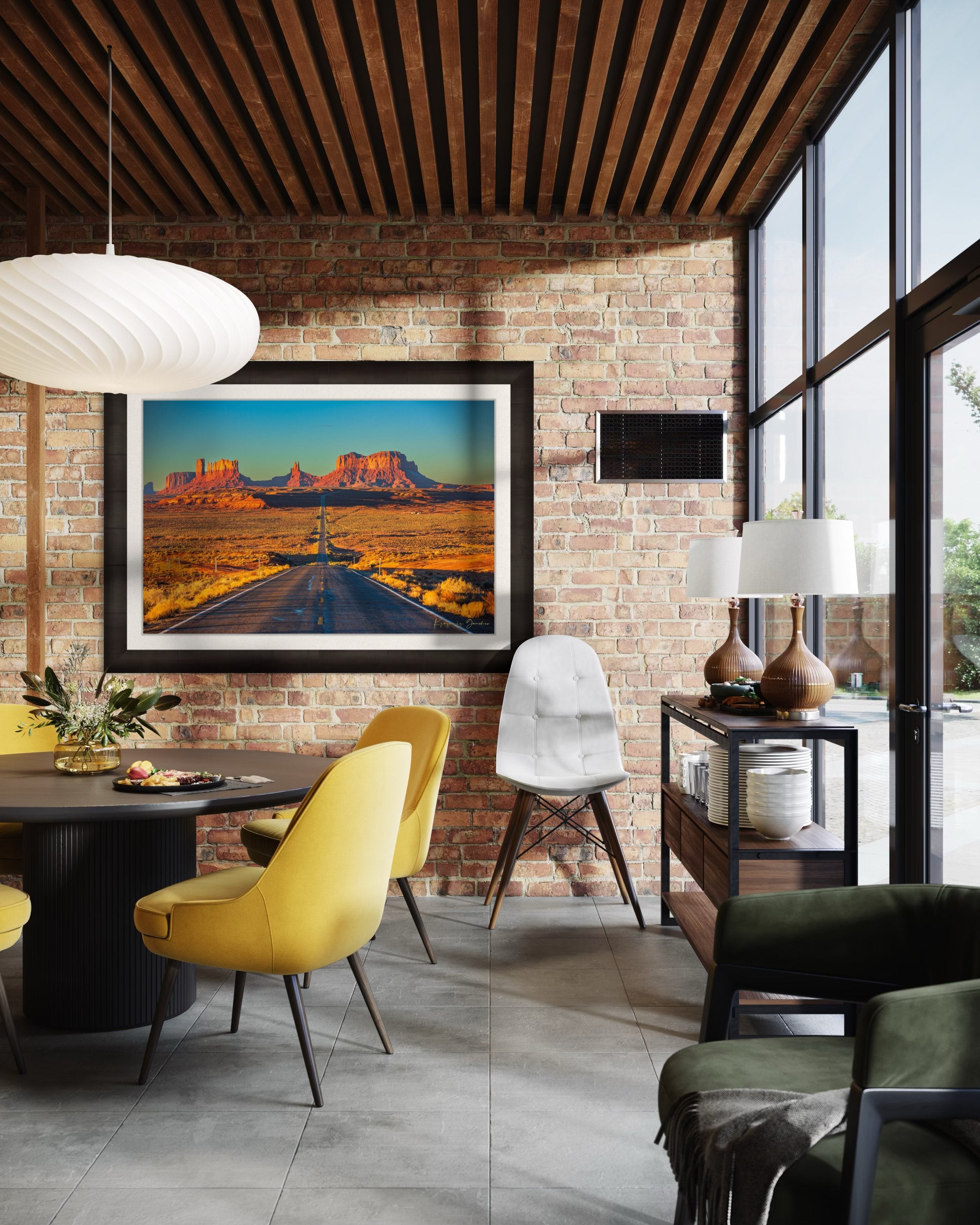 A winding road leads toward distant mesas under a hazy sky in Monument Valley, bathed in warm daylight and soft morning light. #Finish_Roma Dark Ash Frame & Bright Liner