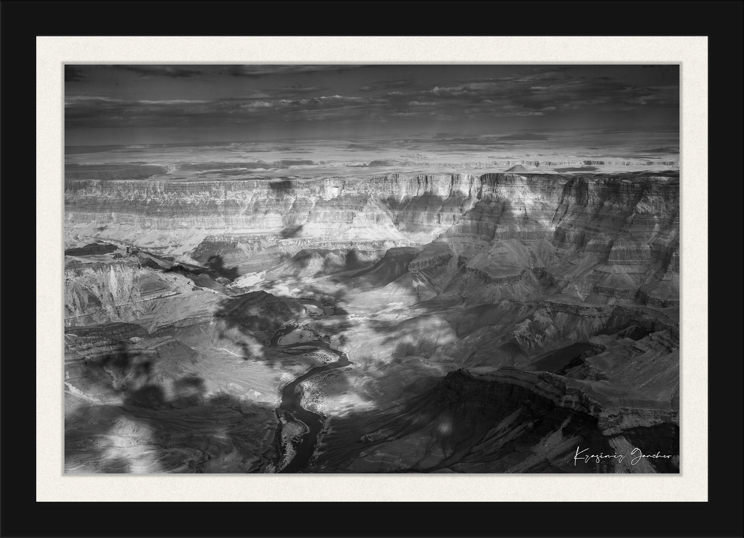Grand Canyon National Park with Colorado River flowing through canyon and desert terrain under daylight conditions. #Finish_Roma Satin Black Frame & Bright Liner