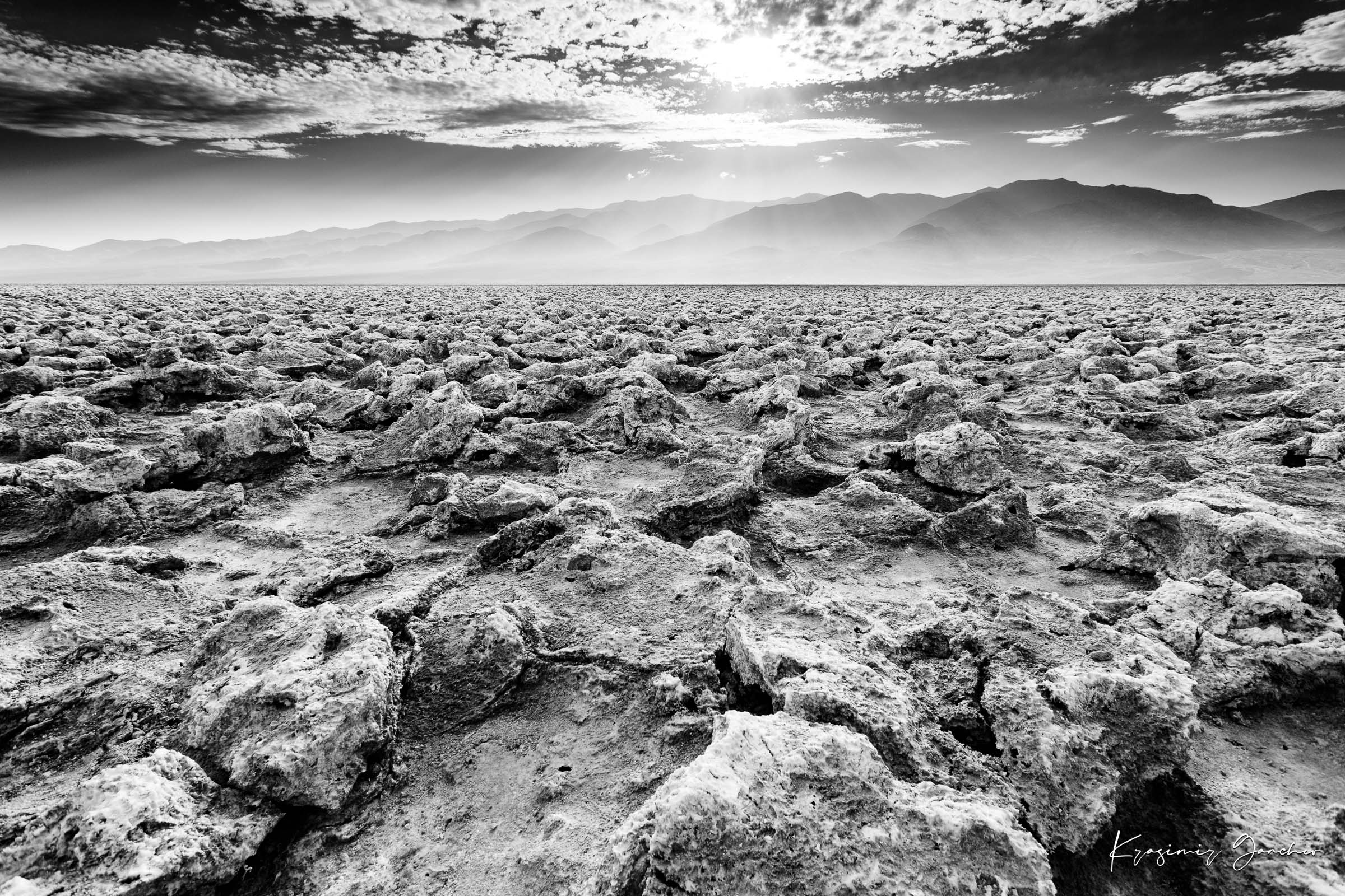 Textured salt pan terrain at Devil's Golf Course in Death Valley National Park under daytime light. #Finish_Acrylic Recess