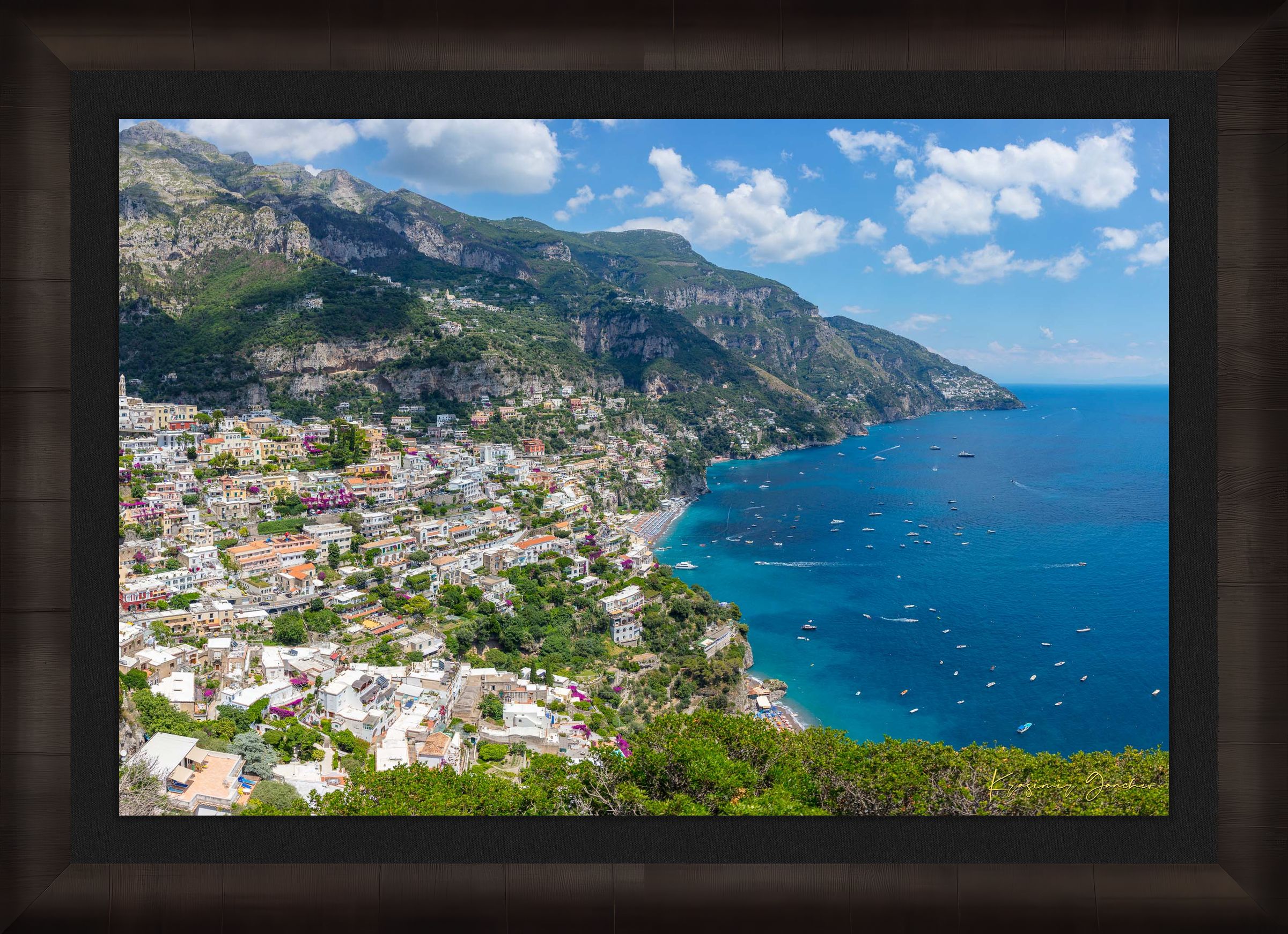 Coastal town of Portofino, Italy, overlooking the Mediterranean Sea with lush green mountains and clear blue sky. #Finish_Roma Dark Ash Frame & Dark Liner