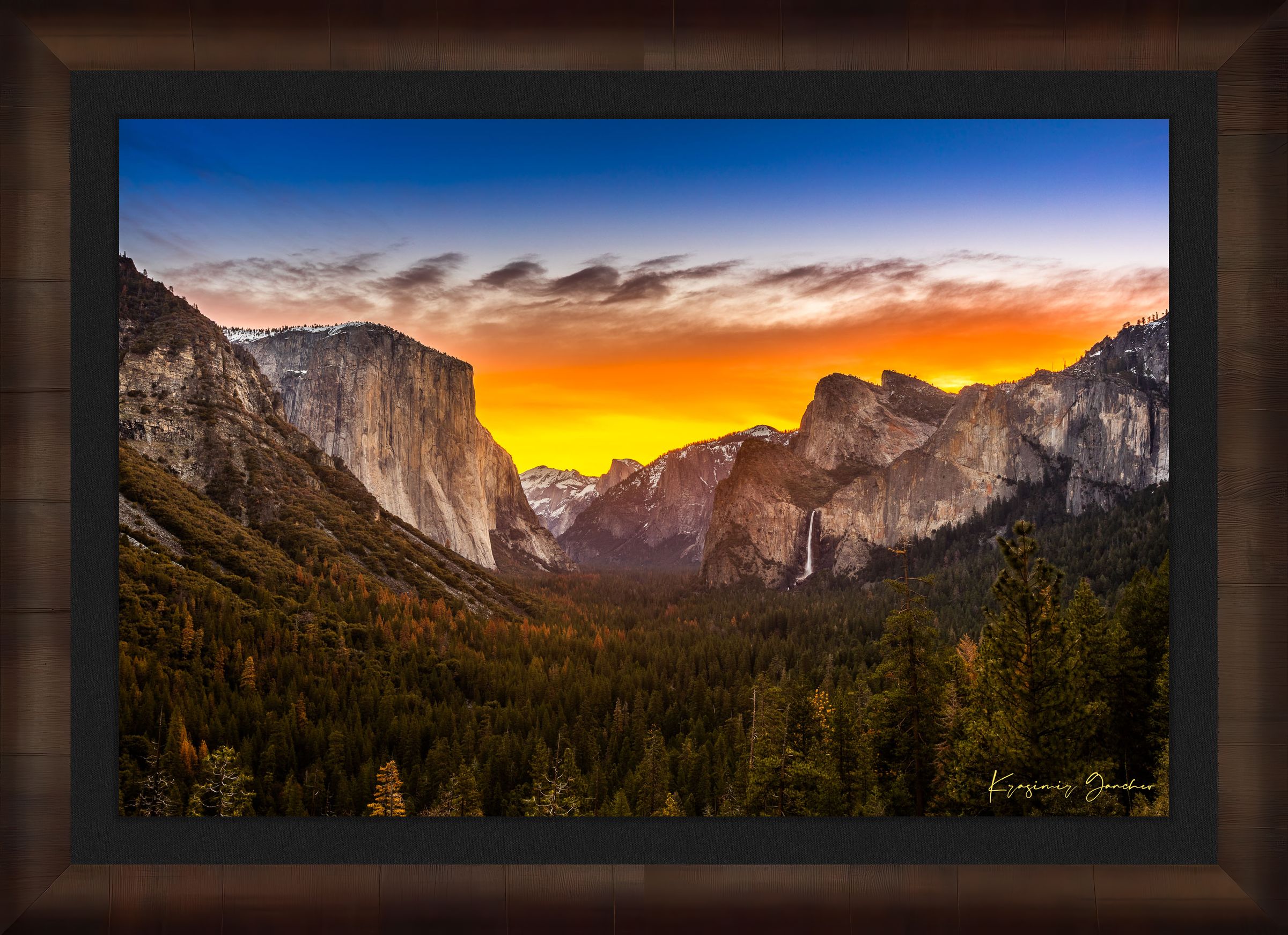 El Capitan rising above Yosemite Valley at sunrise, sunlit peaks framed by layered clouds. #Finish_Roma Cigar Leaf Frame & Dark Liner