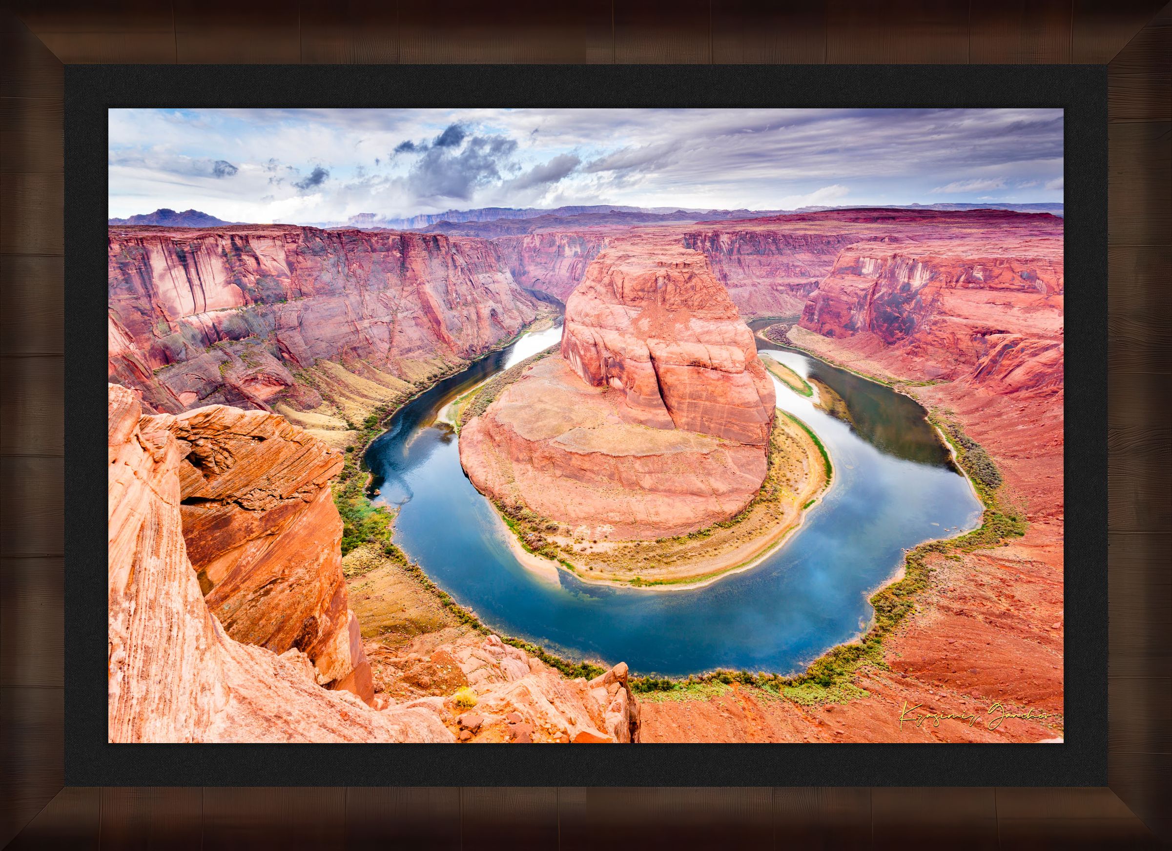 Colorado River curves through Horseshoe Bend at dawn. Water reflects sunlight and surrounding red rock cliffs under cloudy skies. #Finish_Roma Cigar Leaf Frame & Dark Liner