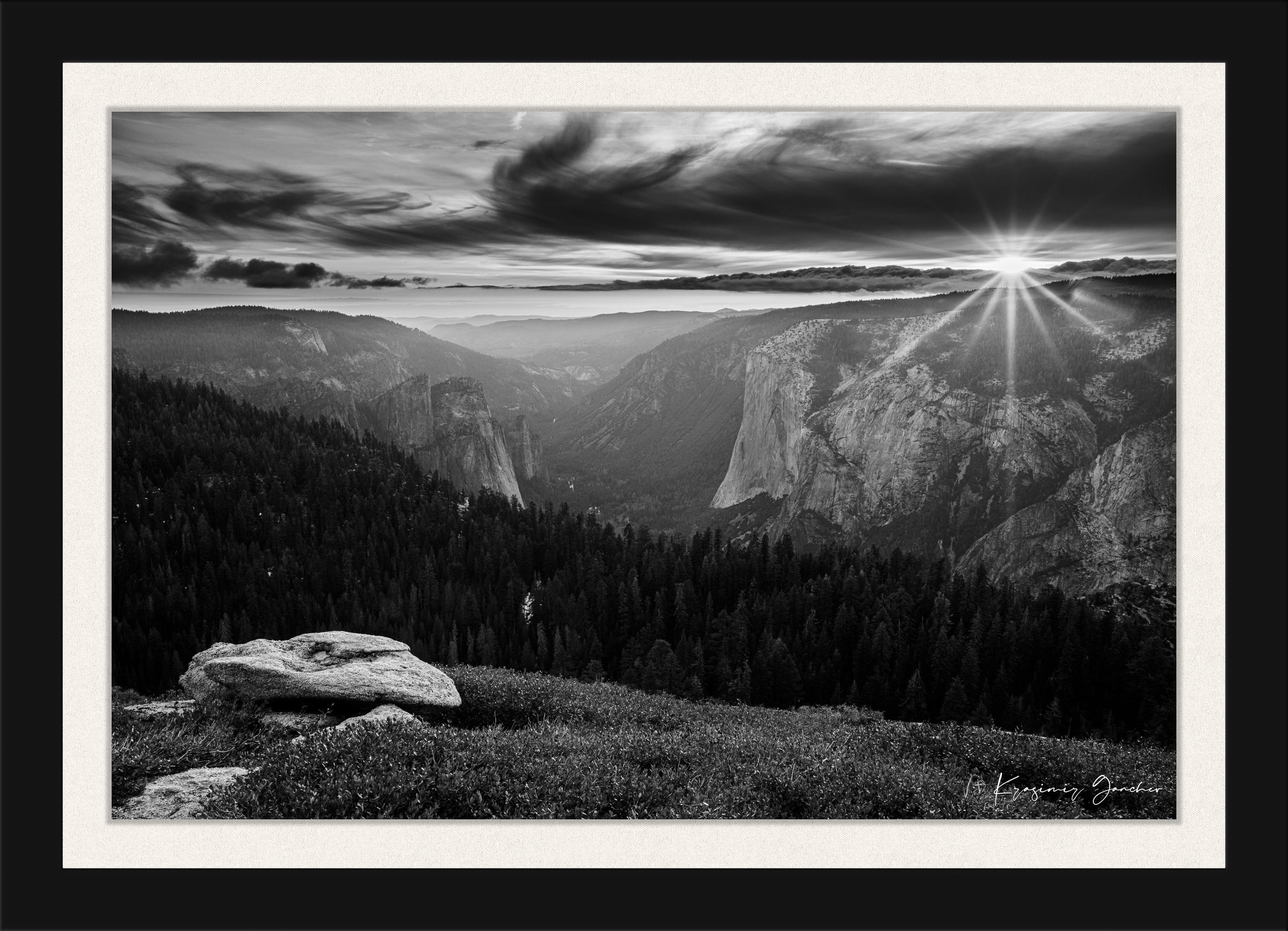 El Capitan at sunset, radiant starburst above horizon casting long shadows on valley terrain. #Finish_Roma Satin Black Frame & Bright Liner