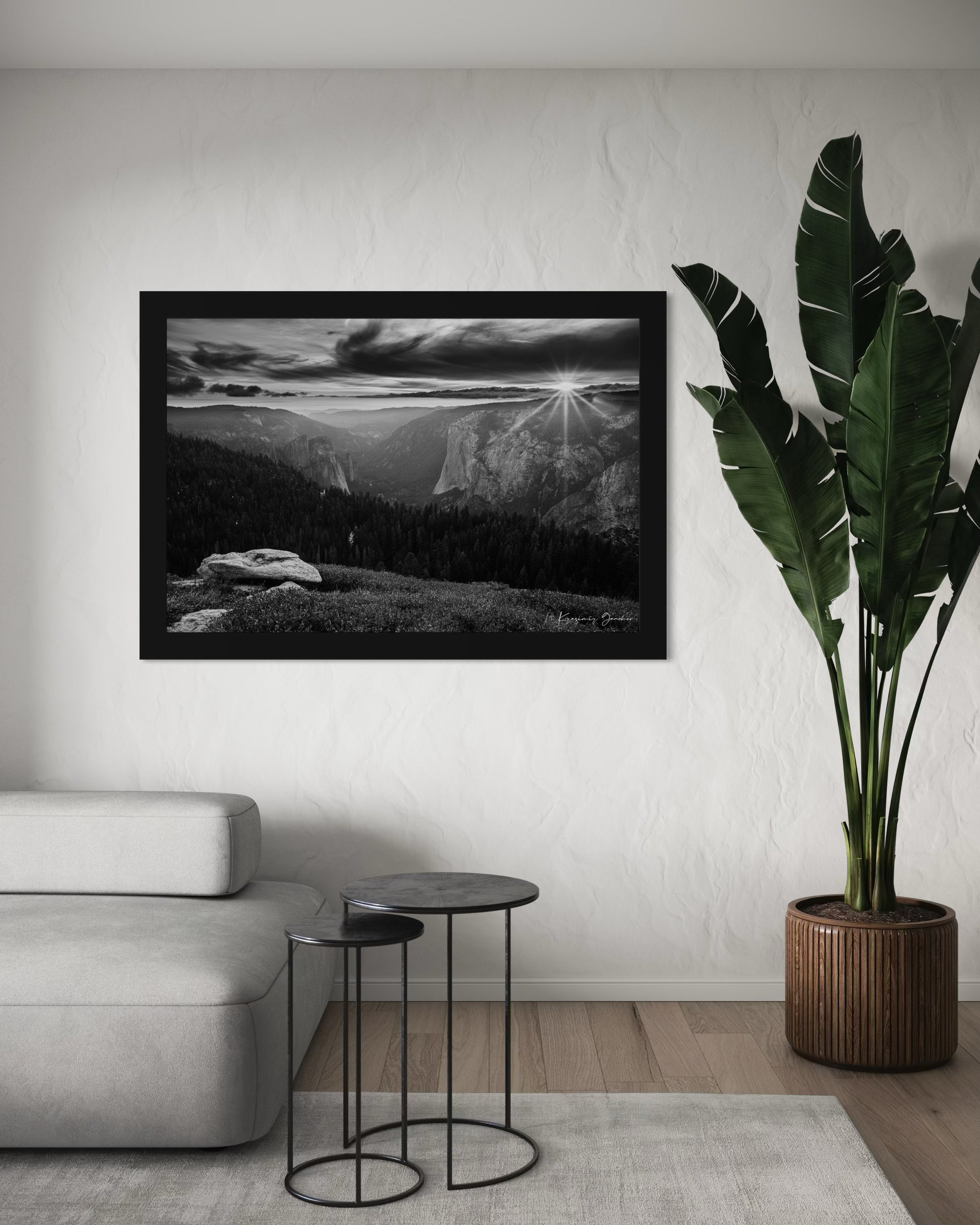 El Capitan at sunset, radiant starburst above horizon casting long shadows on valley terrain. #Finish_Roma Satin Black Frame