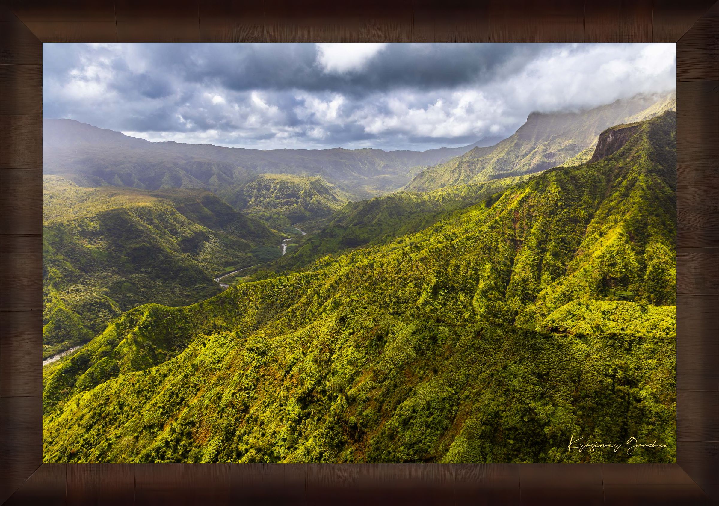 Expansive aerial view of a mountainous valley in Kauai illuminated by daylight, covered in low-lying cloud. #Finish_Roma Cigar Leaf Frame