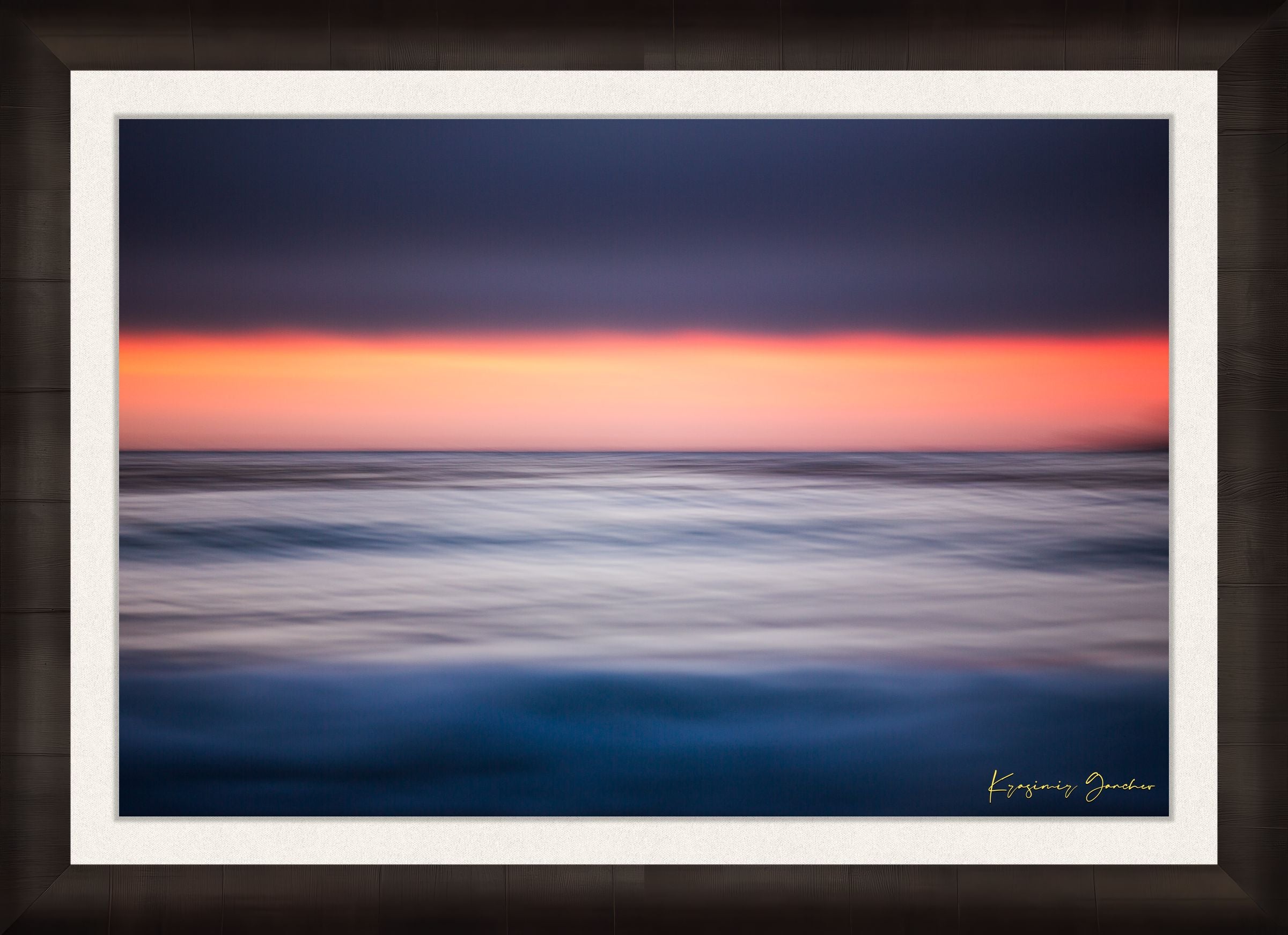 Sunset at Carmel Beach. Ocean horizon blends soft colors of dusk under cloudy skies with gentle wave blur. #Finish_Roma Dark Ash Frame & Bright Liner