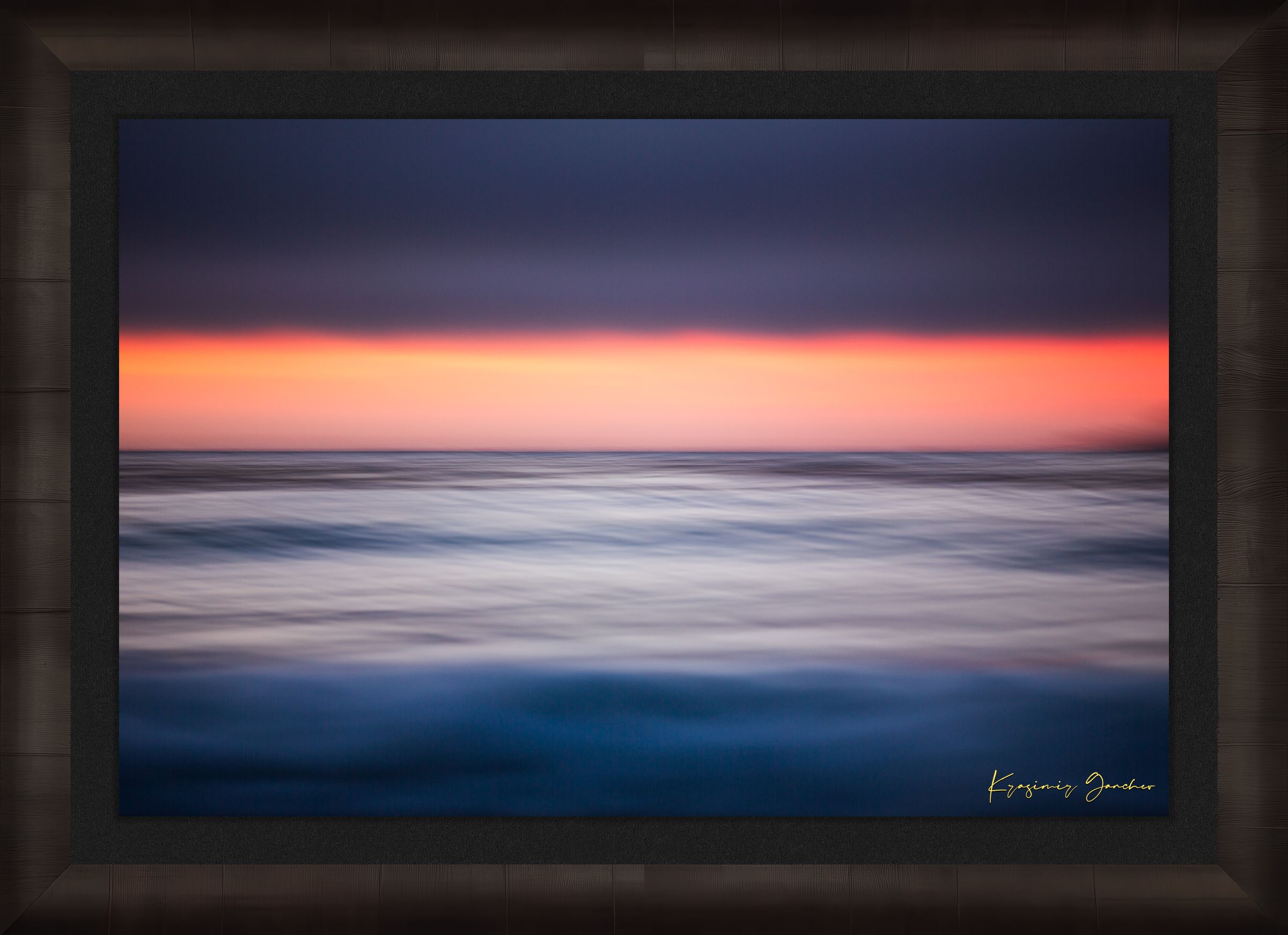 Sunset at Carmel Beach. Ocean horizon blends soft colors of dusk under cloudy skies with gentle wave blur. #Finish_Roma Dark Ash Frame & Dark Liner