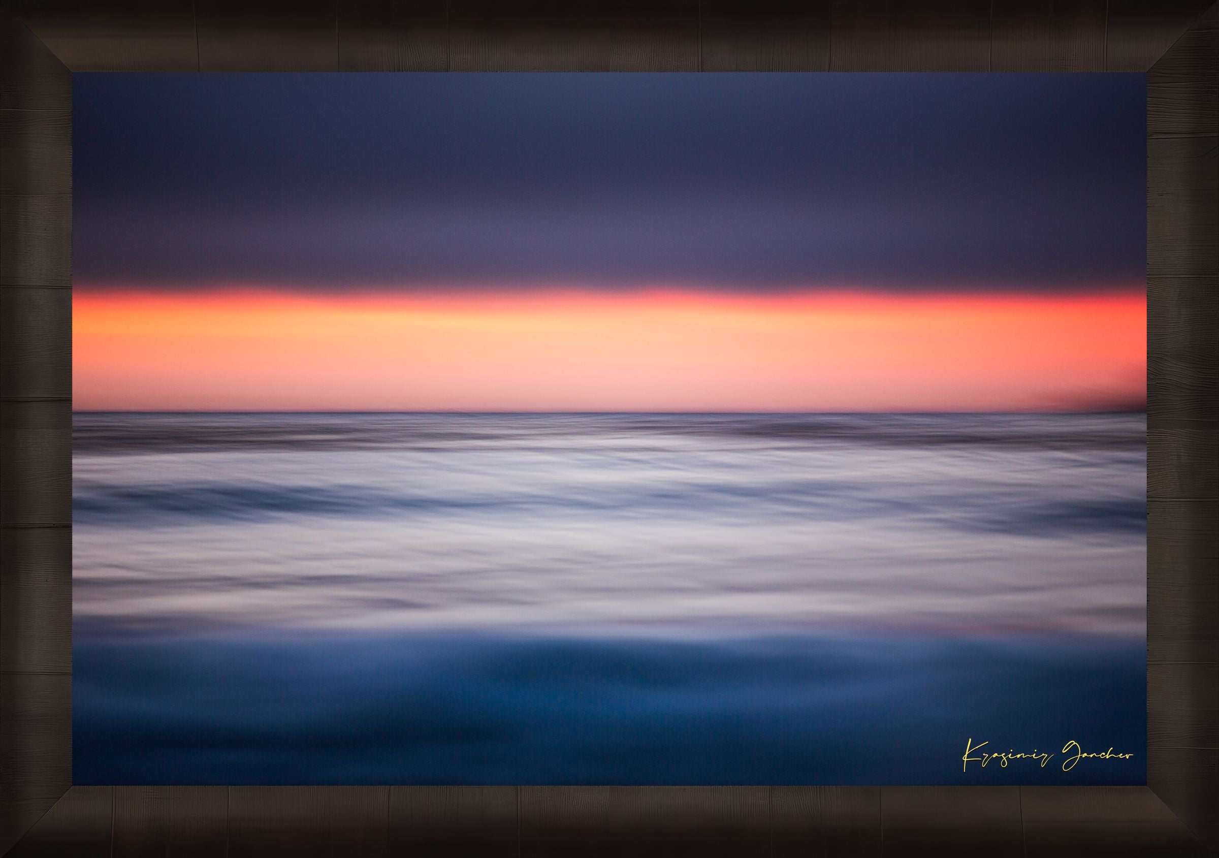 Sunset at Carmel Beach. Ocean horizon blends soft colors of dusk under cloudy skies with gentle wave blur. #Finish_Roma Dark Ash Frame