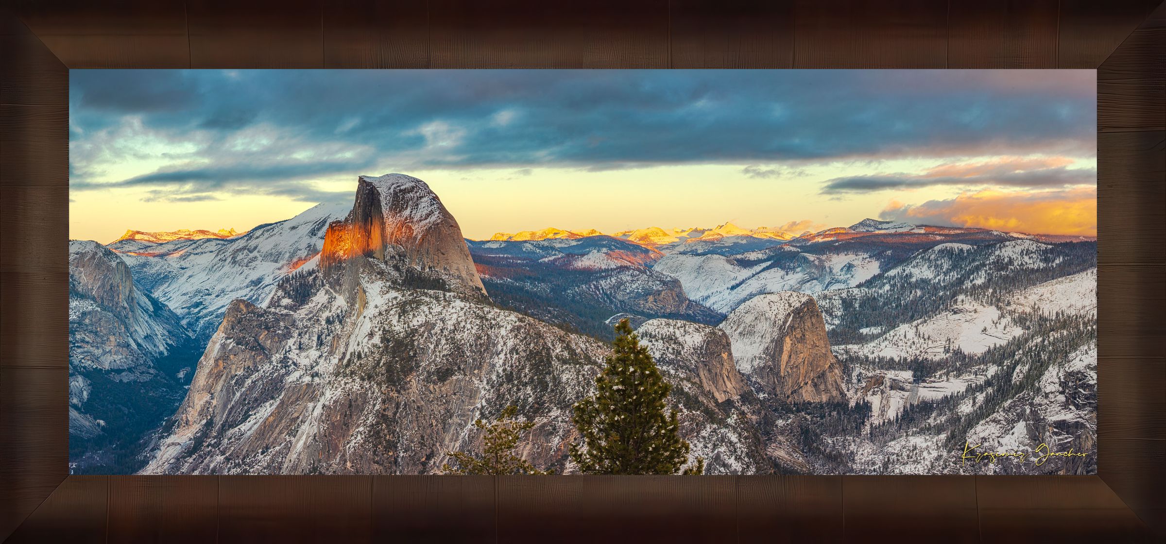 Sunset view of Half Dome monolith with dynamic shadows and sunlight over snow-dusted peaks and clouds in Yosemite National Park. #Finish_Roma Cigar Leaf Frame