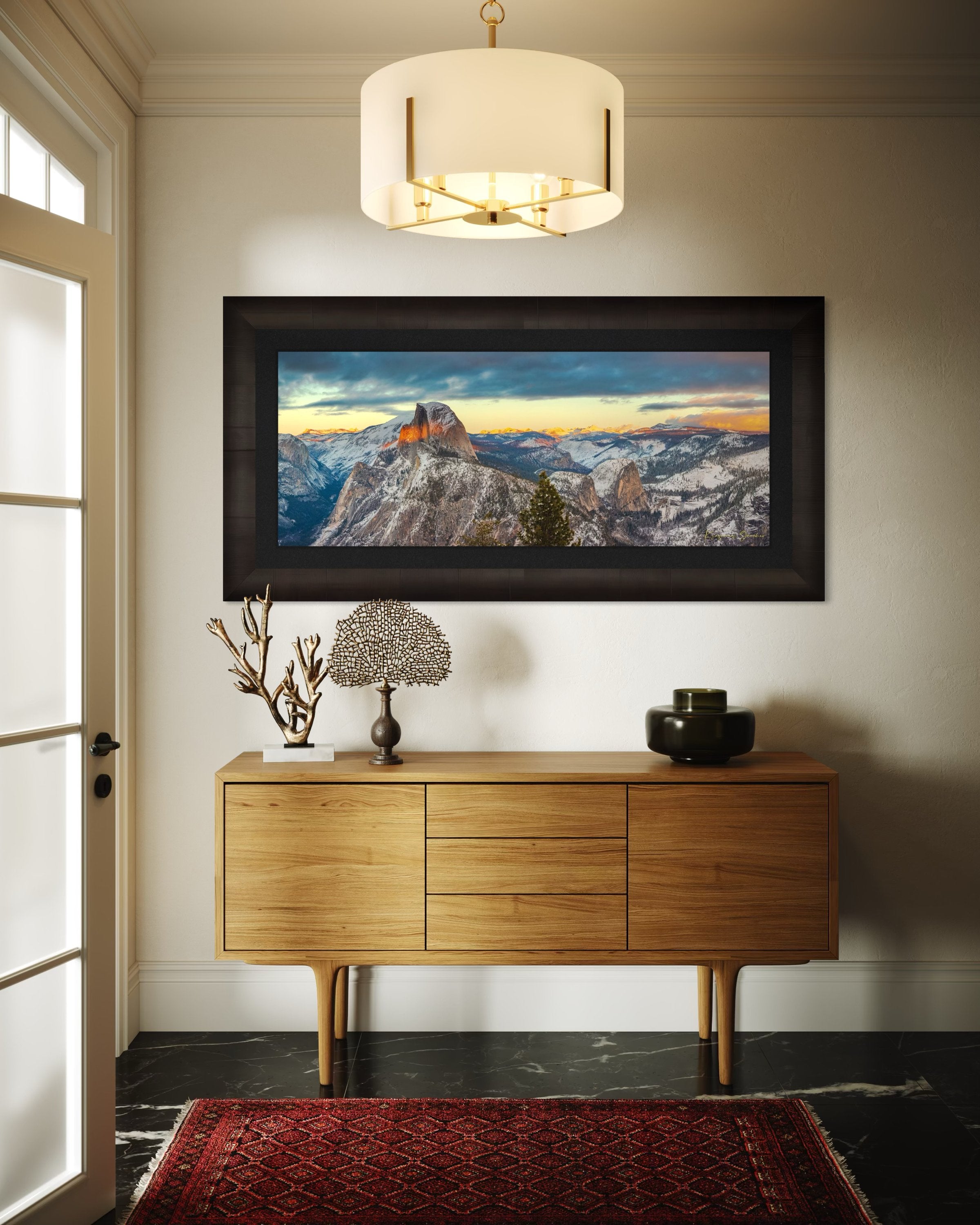 Sunset view of Half Dome monolith with dynamic shadows and sunlight over snow-dusted peaks and clouds in Yosemite National Park. #Finish_Roma Dark Ash Frame & Dark Liner