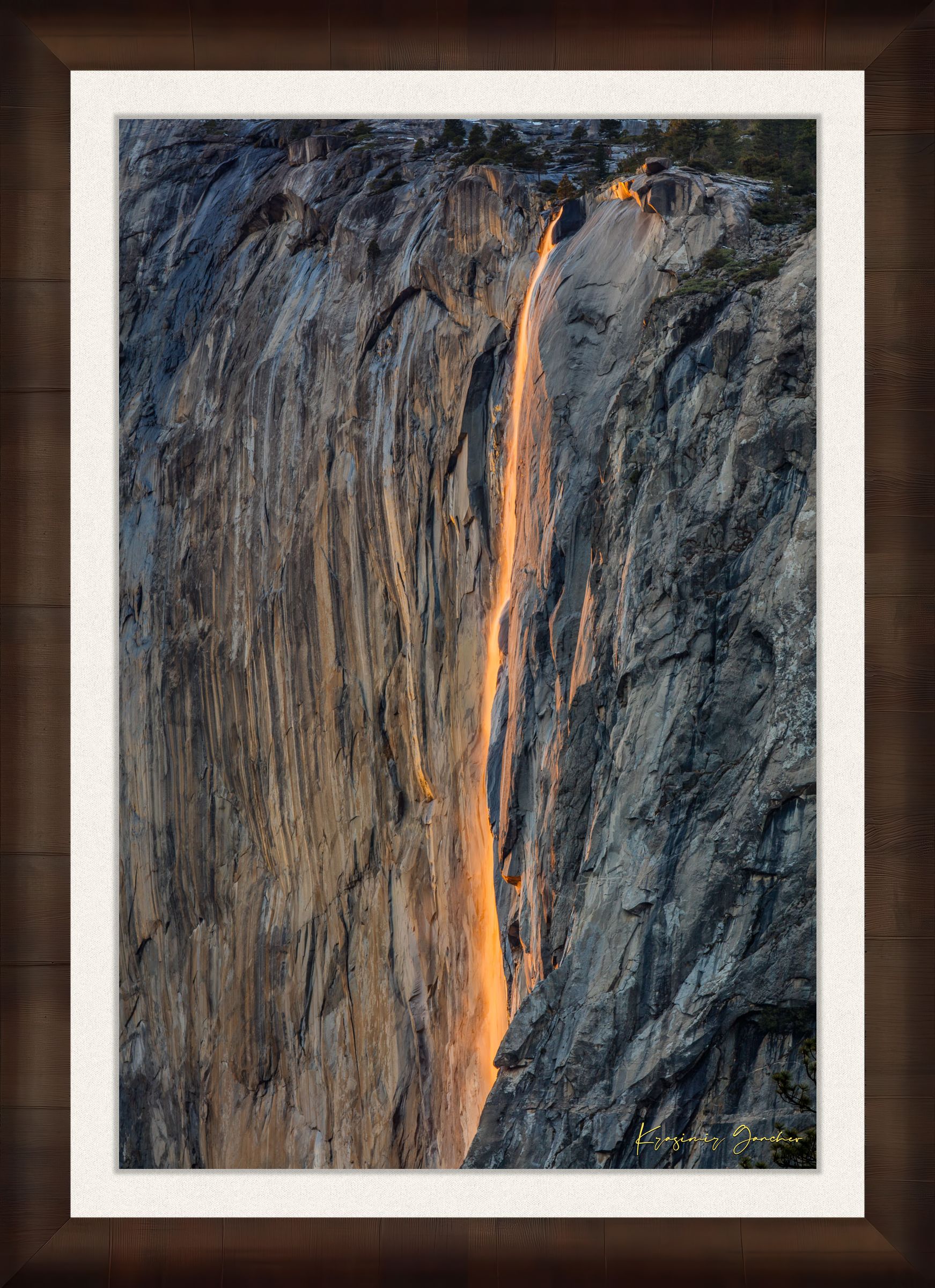 Detailed view of the firefall effect on El Capitan monolith with glowing sunlight refracting through mist from Horsetail Fall in Yosemite. #Finish_Roma Cigar Leaf Frame & Bright Liner
