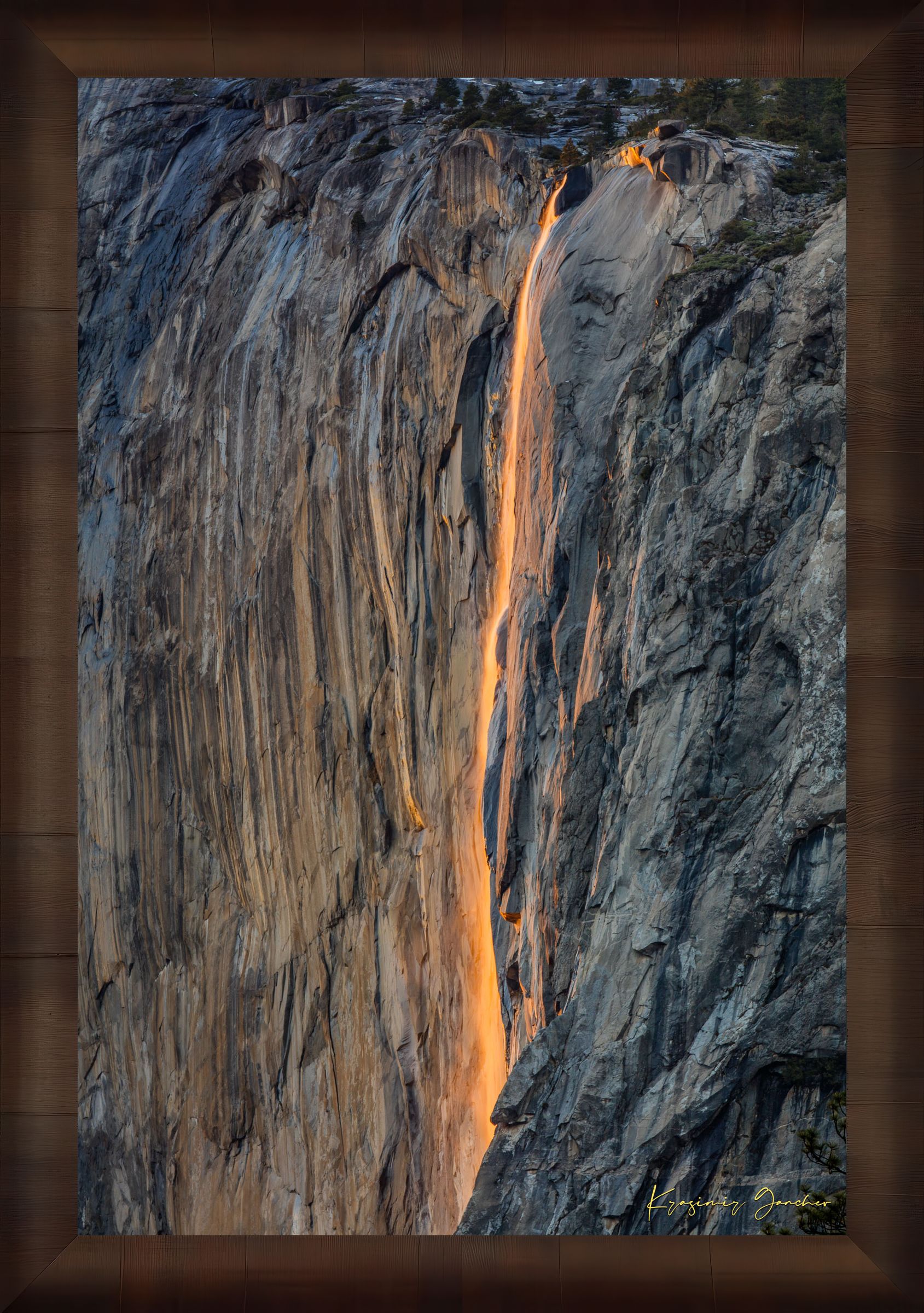 Detailed view of the firefall effect on El Capitan monolith with glowing sunlight refracting through mist from Horsetail Fall in Yosemite. #Finish_Roma Cigar Leaf Frame