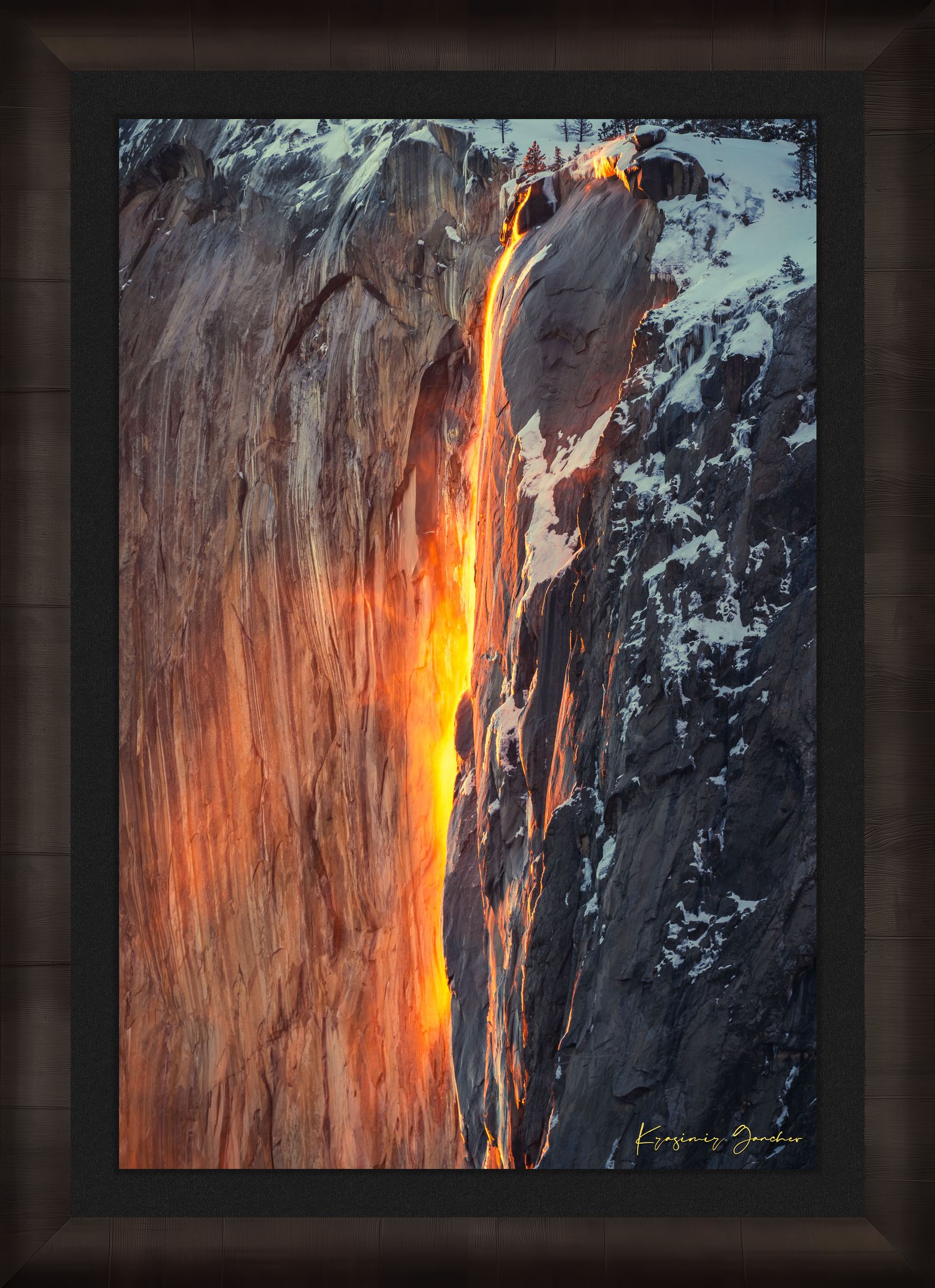 Spectacular sunset view of El Capitan, showing firefall light reflecting on Horsetail Fall amid snowy mountains. #Finish_Roma Dark Ash Frame & Dark Liner