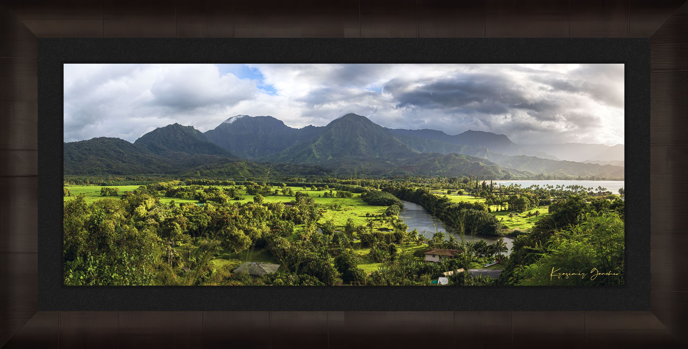 Lush green slopes of Hanalei Valley on Kauai with ocean, trees, and distant bay at daylight. #Finish_Roma Dark Ash Frame & Dark Liner