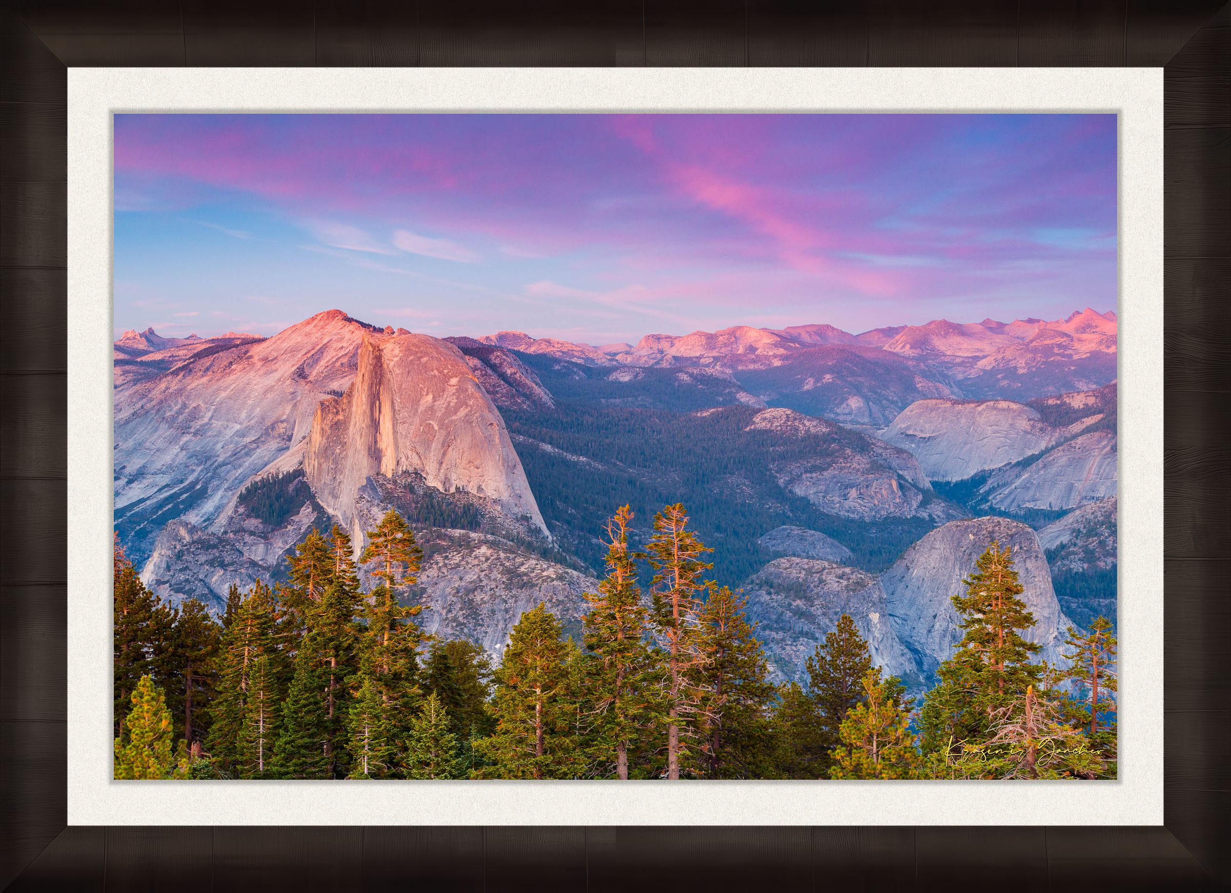 Granite monolith of Half Dome silhouetted against colorful sunset skies over Yosemite National Park with cloud layers. #Finish_Roma Dark Ash Frame & Bright Liner