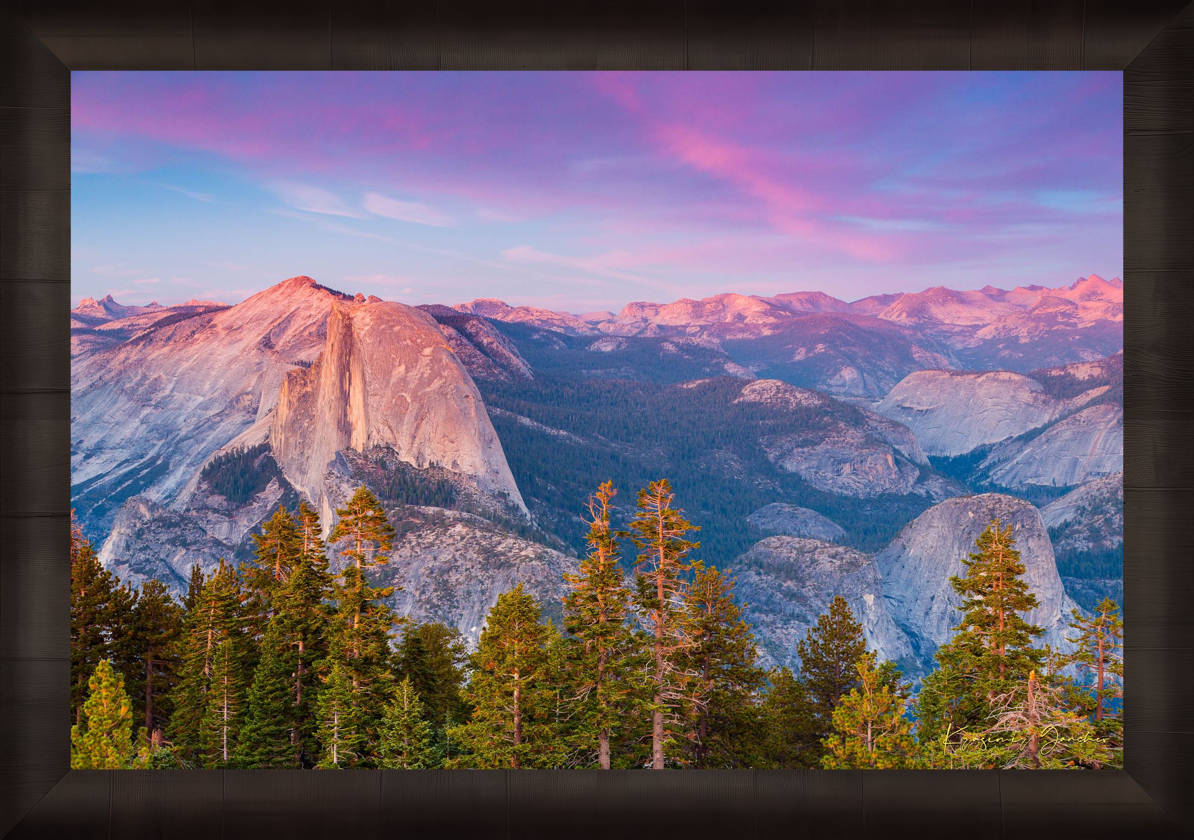 Granite monolith of Half Dome silhouetted against colorful sunset skies over Yosemite National Park with cloud layers. #Finish_Roma Dark Ash Frame