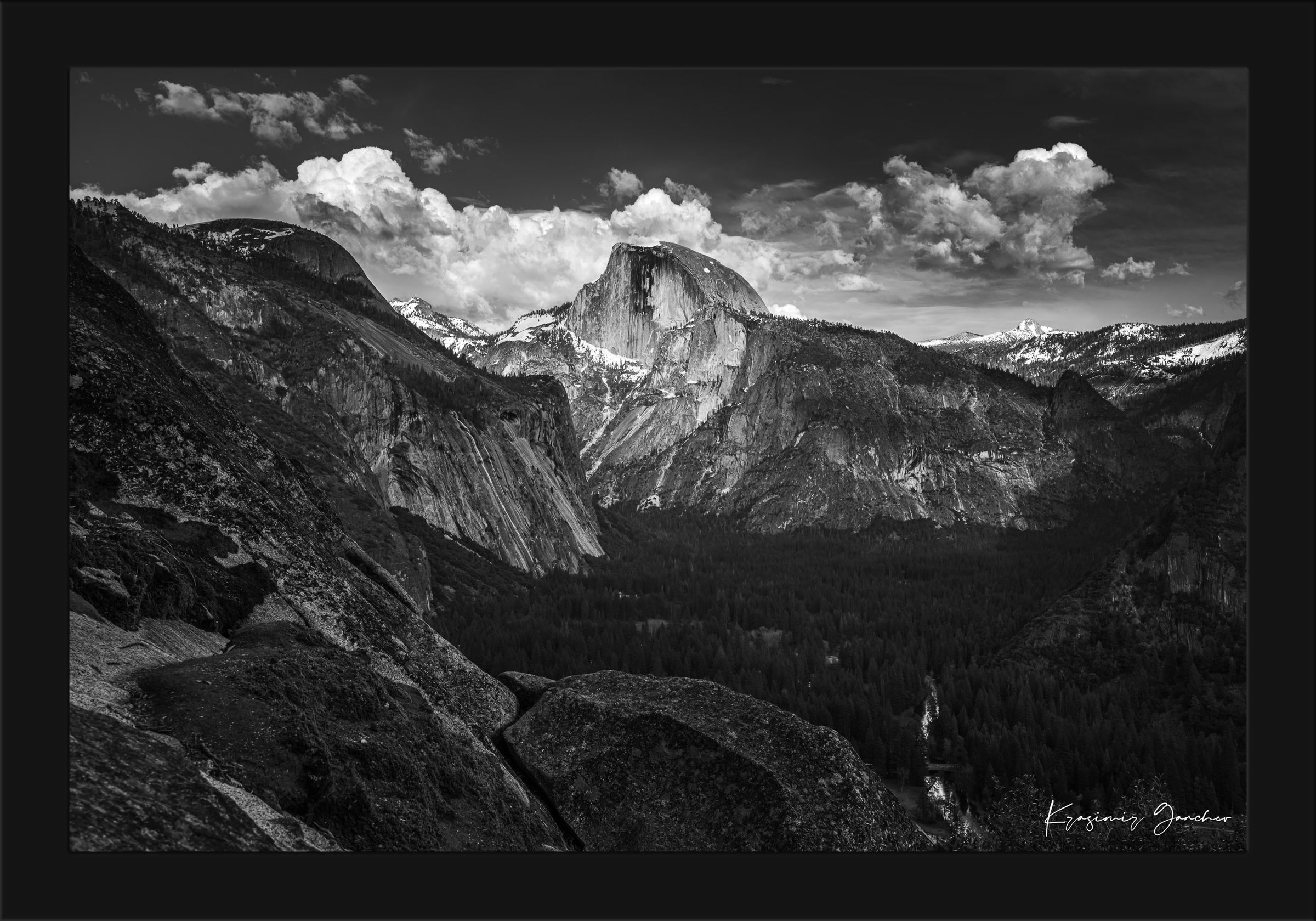 Half Dome silhouetted against sunset sky with drifting clouds above Yosemite Valley. #Finish_Roma Satin Black Frame