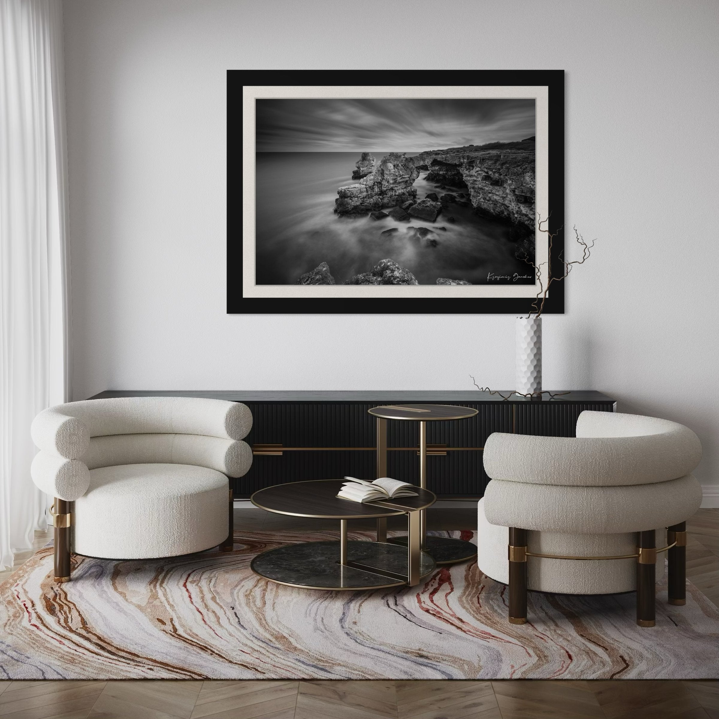A stone arch formation near coastal cliffs in monochrome, with waves crashing against it. #Finish_Roma Satin Black Frame & Bright Liner