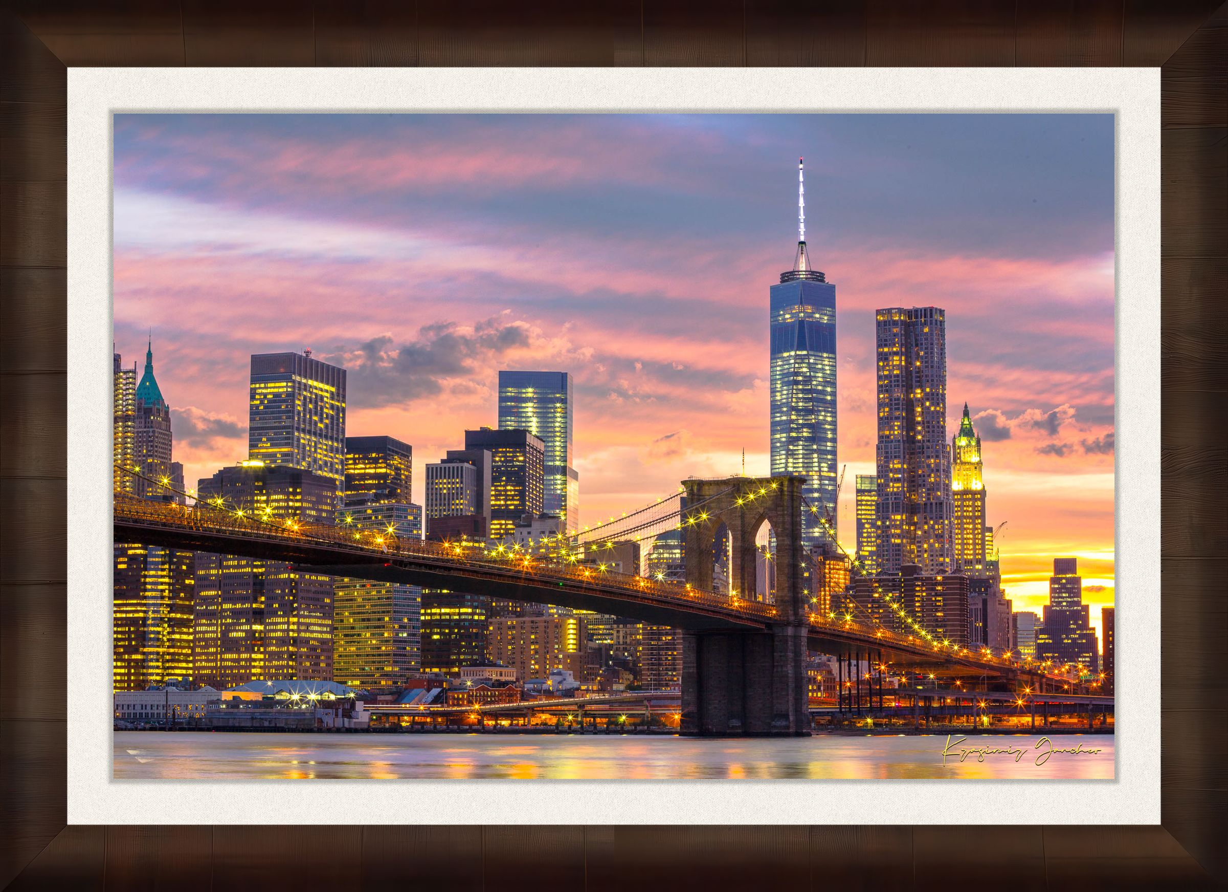 The Brooklyn Bridge viewed from Manhattan during evening hours as sunlight fades into artificial lighting under cloudy skies. #Finish_Roma Cigar Leaf Frame & Bright Liner