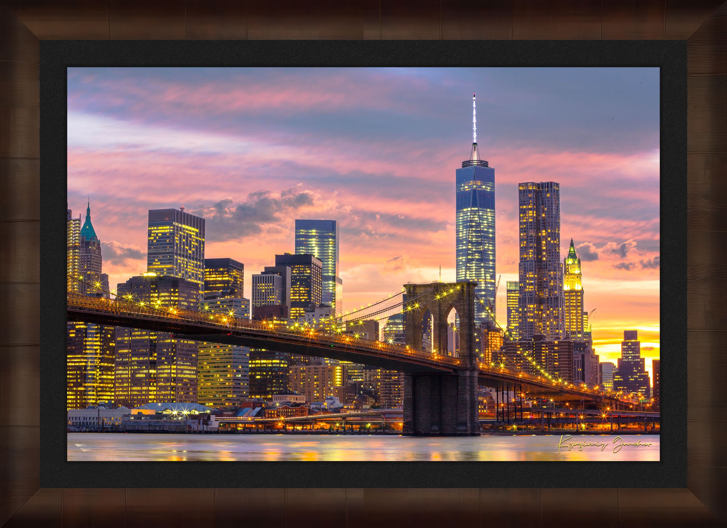 The Brooklyn Bridge viewed from Manhattan during evening hours as sunlight fades into artificial lighting under cloudy skies. #Finish_Roma Cigar Leaf Frame & Dark Liner
