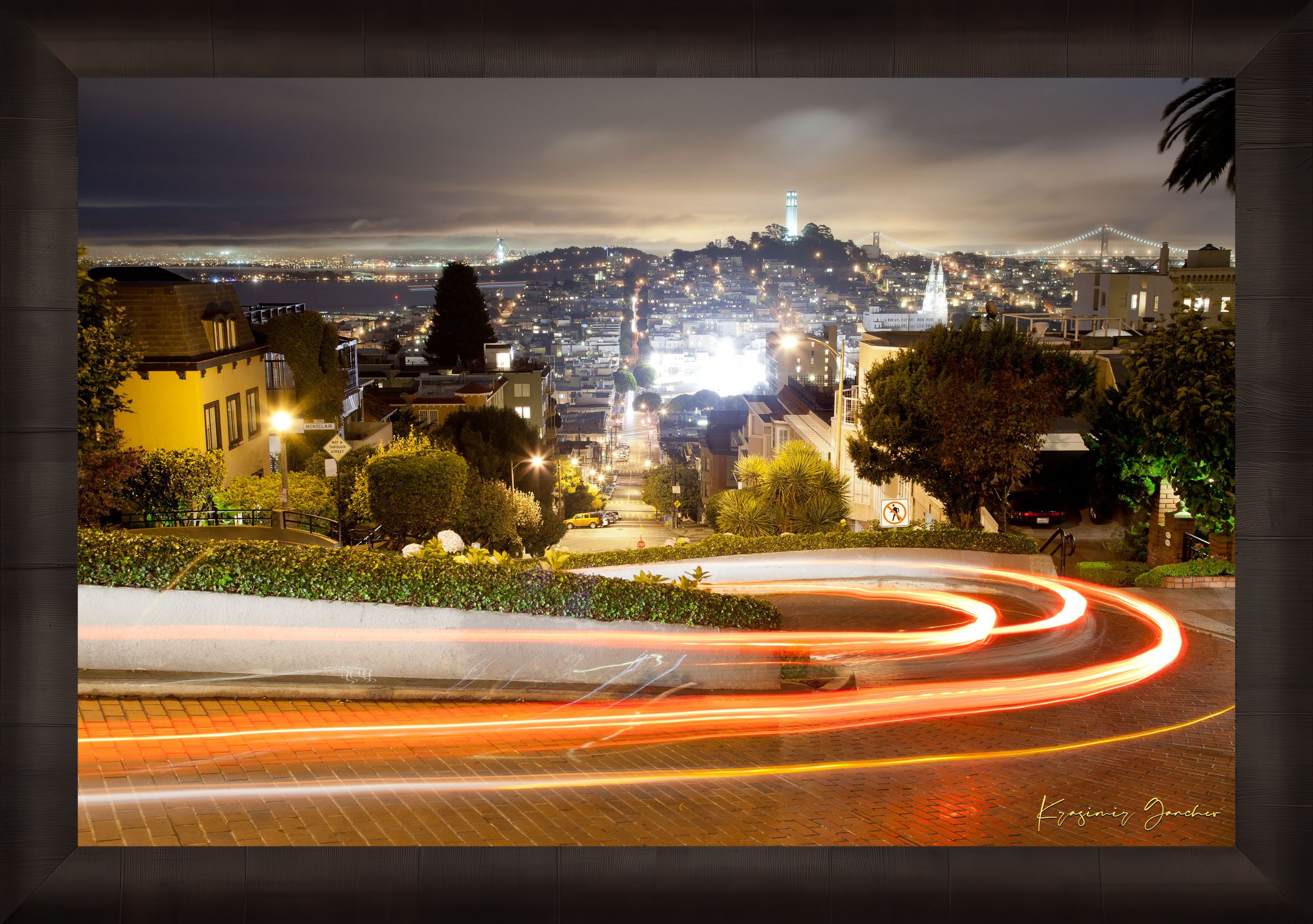 Nighttime Lombard Street in San Francisco showing long exposure light trails under cloudy skies. #Finish_Roma Dark Ash Frame