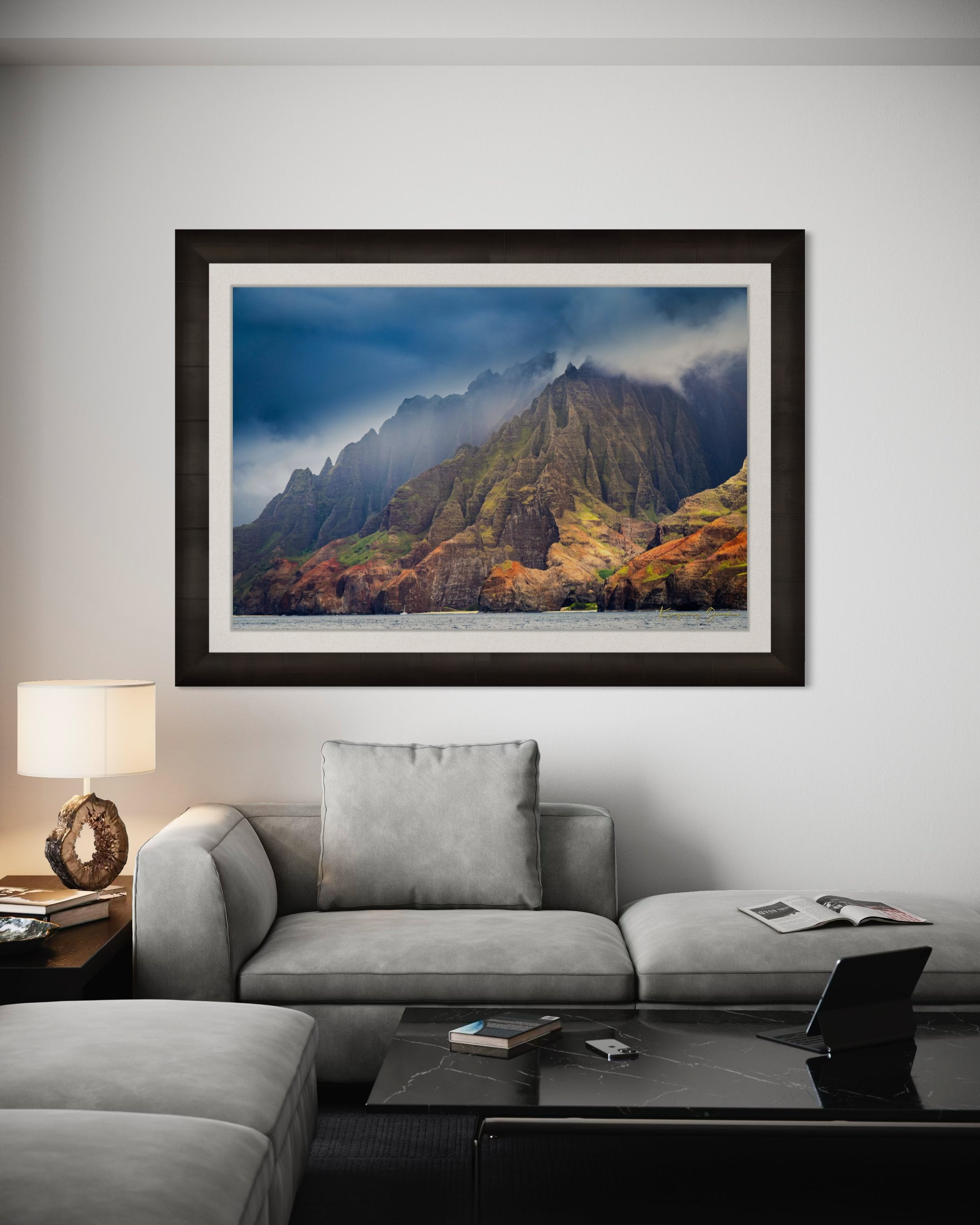 Rugged coastal cliff face rising from the Pacific Ocean at Napali Coast, Kauai, with light breaking through storm clouds. #Finish_Roma Dark Ash Frame & Bright Liner
