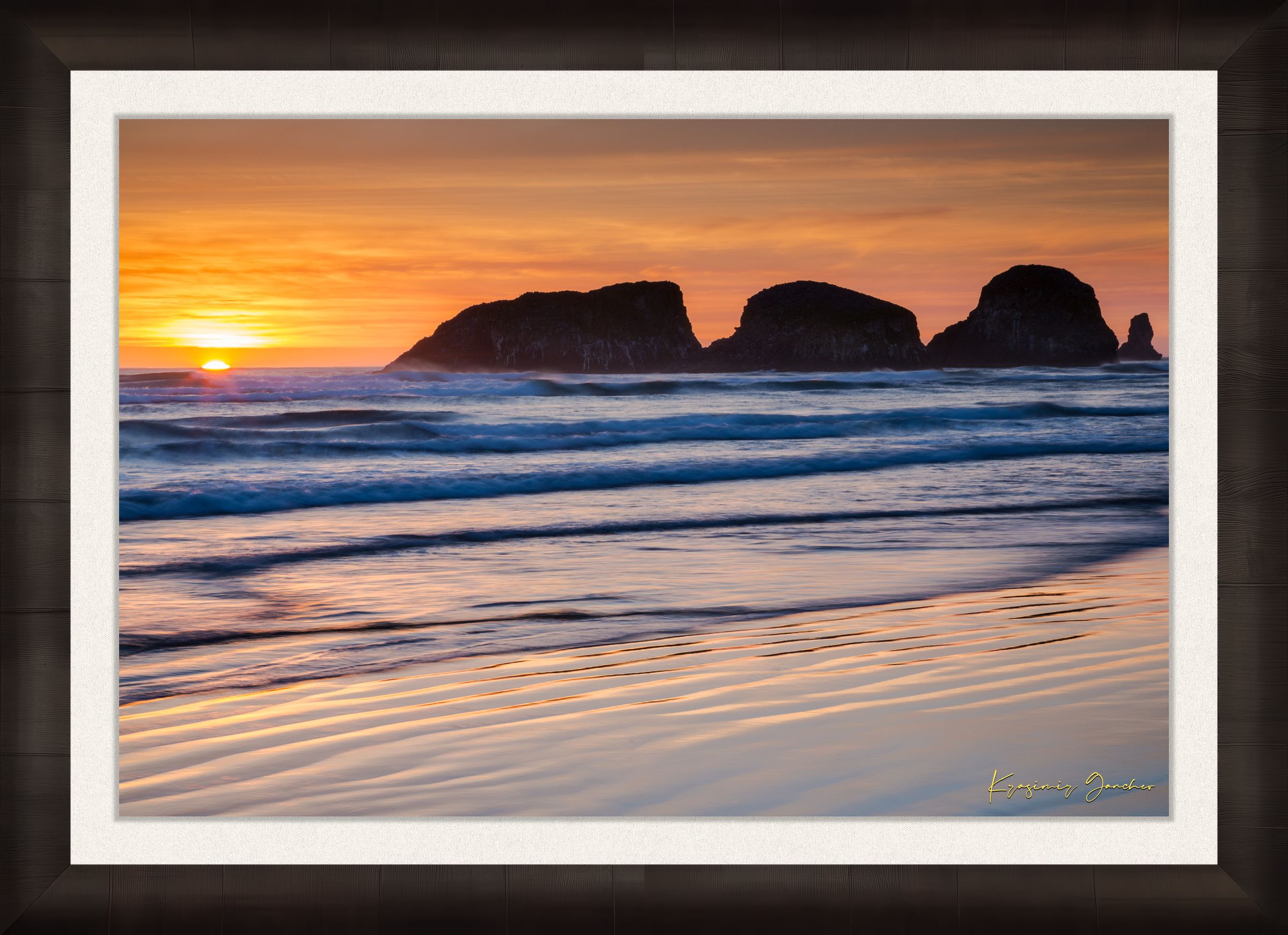 Bird Rock at Cannon Beach, Oregon, during sunset with reflections in the wet sand and ocean under cloudy skies. #Finish_Roma Dark Ash Frame & Bright Liner