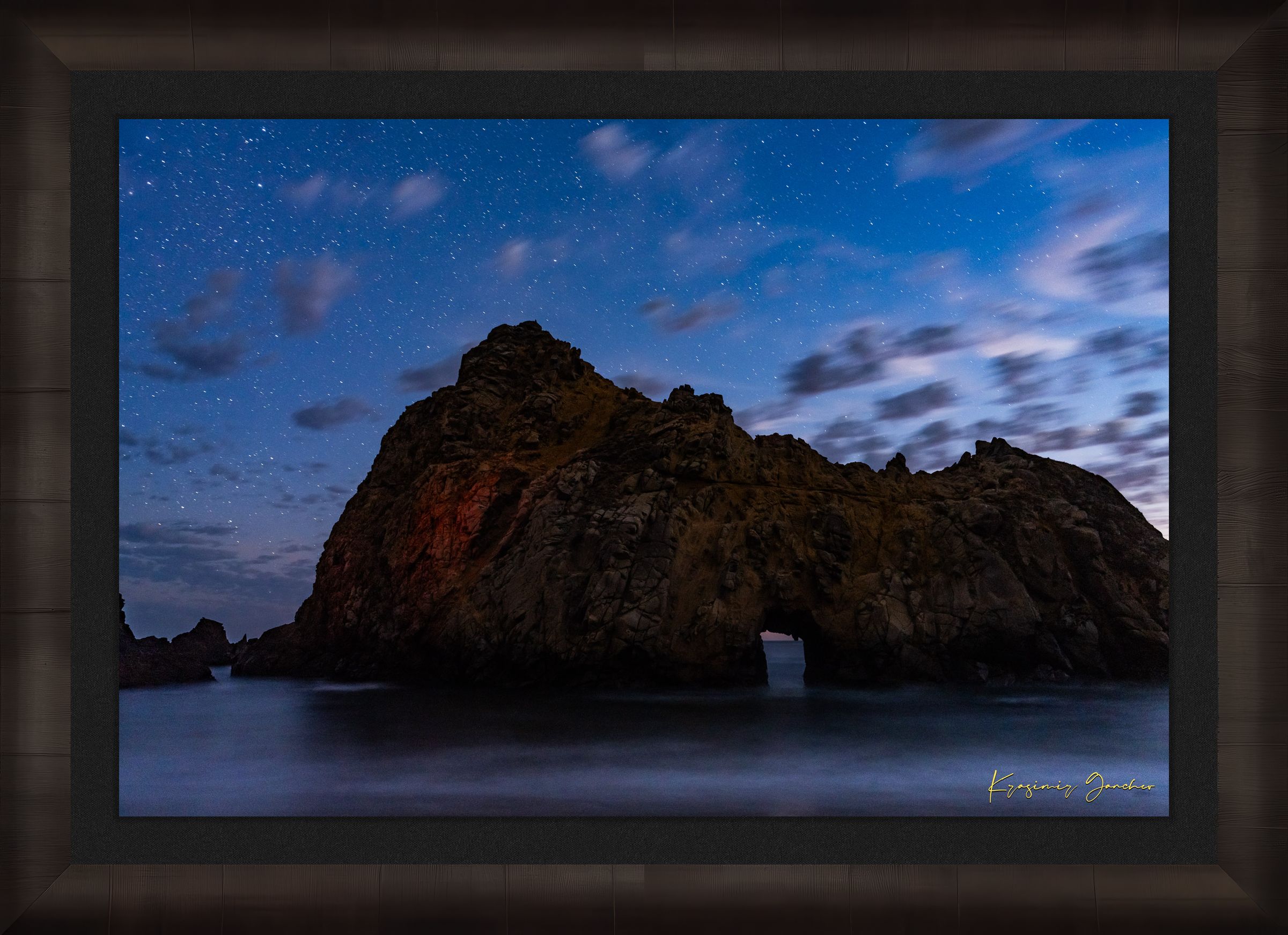 Keyhole Arch silhouette against a starry sky over the ocean at Pfeiffer Beach in Big Sur, California. #Finish_Roma Dark Ash Frame & Dark Liner