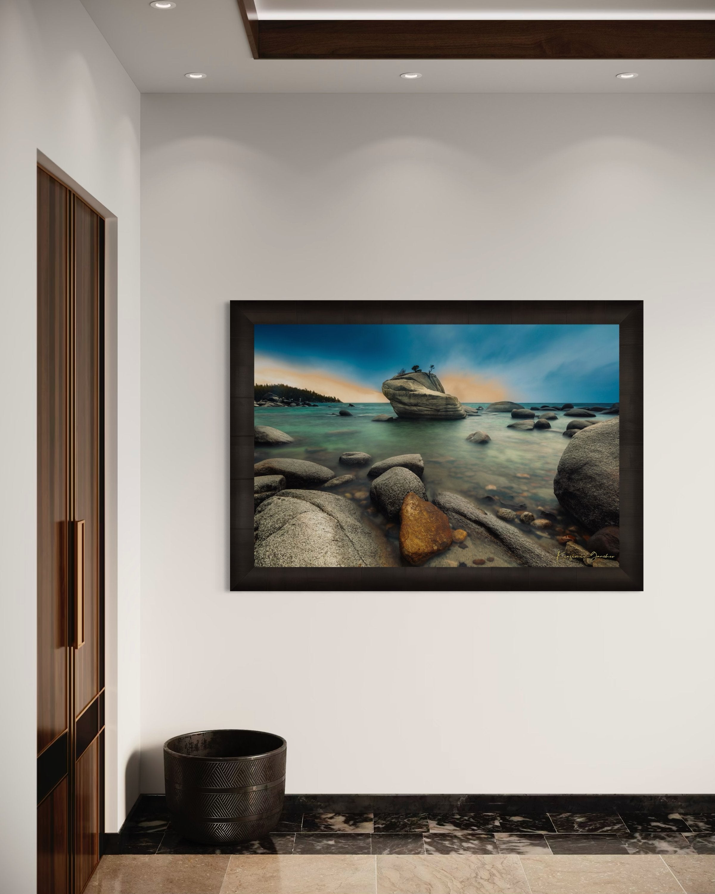 Bonsai Rock formation beside a calm lake in Lake Tahoe during sunset with gentle ripples and clouds. #Finish_Roma Dark Ash Frame