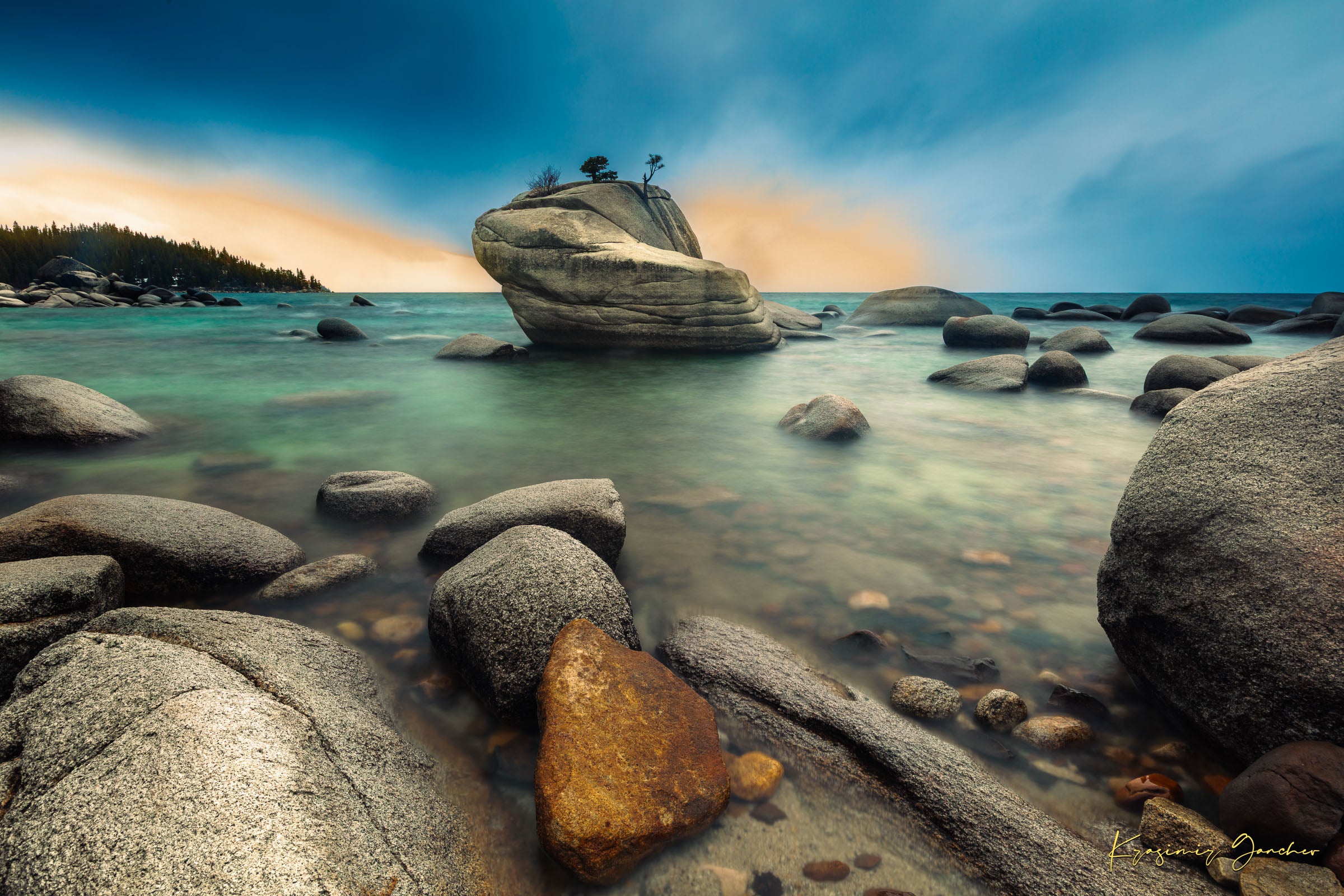 Bonsai Rock formation beside a calm lake in Lake Tahoe during sunset with gentle ripples and clouds. #Finish_Acrylic Recess