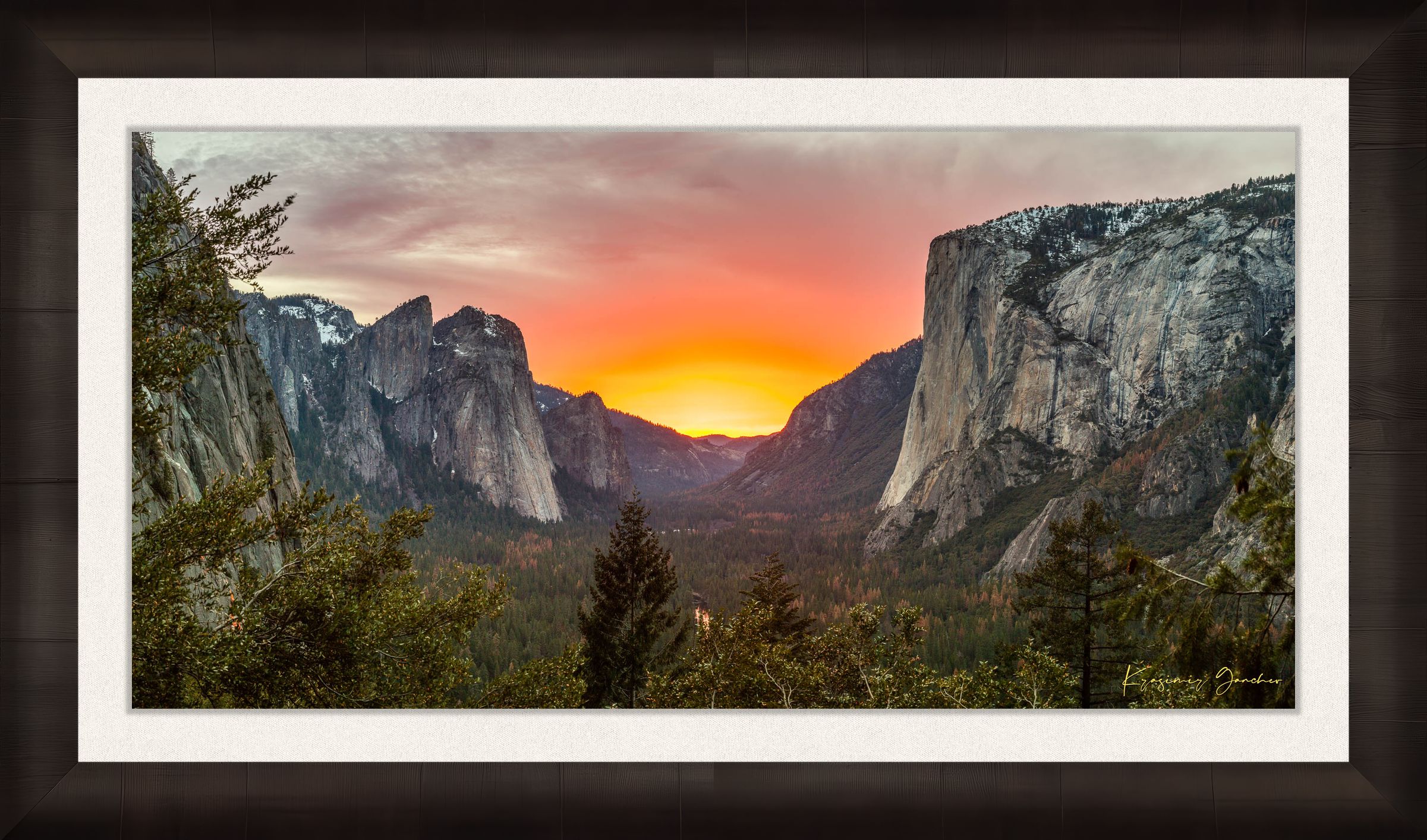El Capitan monolith in Yosemite Valley at sunset, cloud layers glowing softly under golden light. #Finish_Roma Dark Ash Frame & Bright Liner