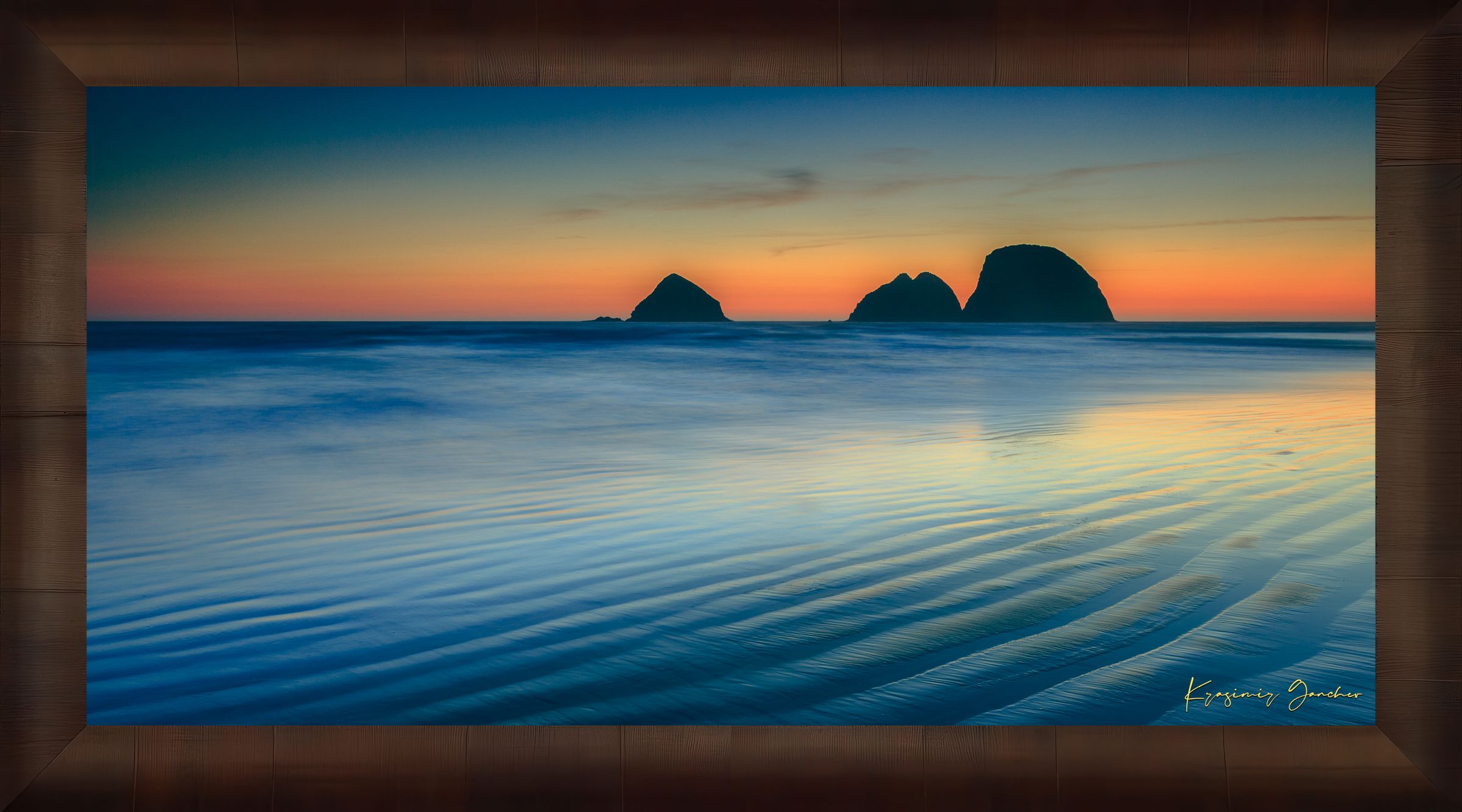Silhouette of Bird Rock formations against a hazy twilight sky along Canon Beach oceanfront during dusk. #Finish_Roma Cigar Leaf Frame