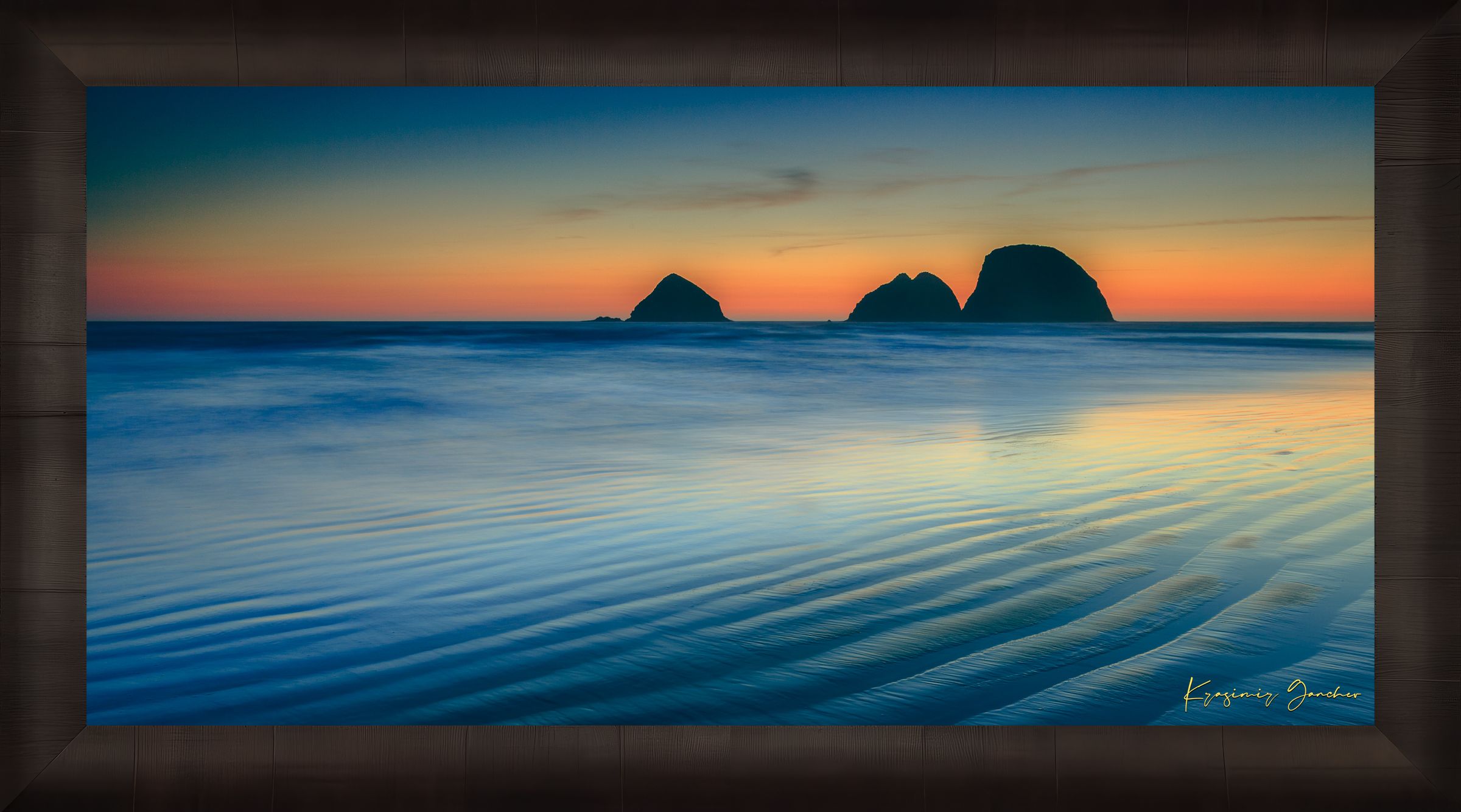Silhouette of Bird Rock formations against a hazy twilight sky along Canon Beach oceanfront during dusk. #Finish_Roma Dark Ash Frame