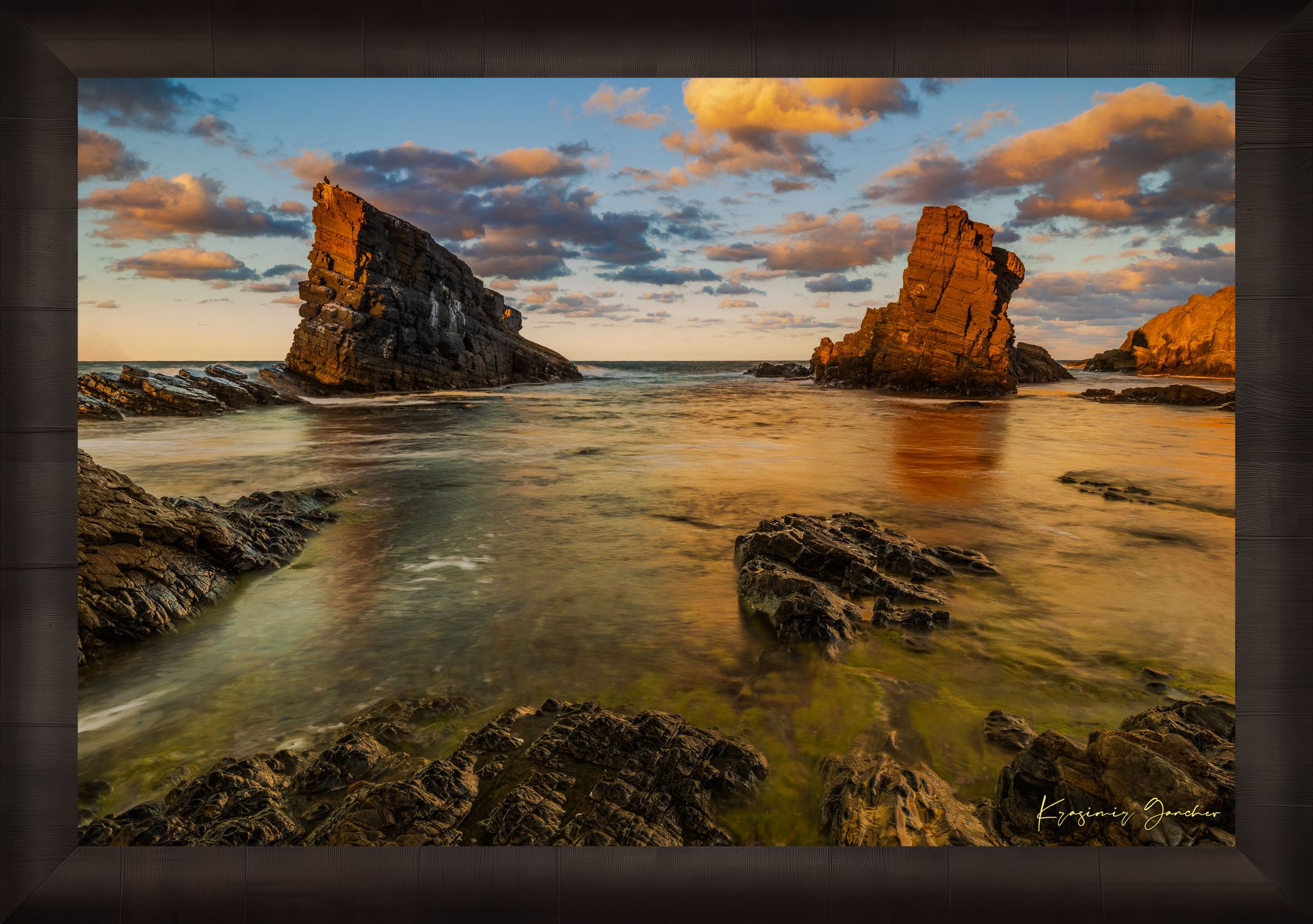 The Stone Ships boulders and sea stacks at Sinemorets, Bulgaria, illuminated by golden sunset light reflecting on calm sea waters. #Finish_Roma Dark Ash Frame