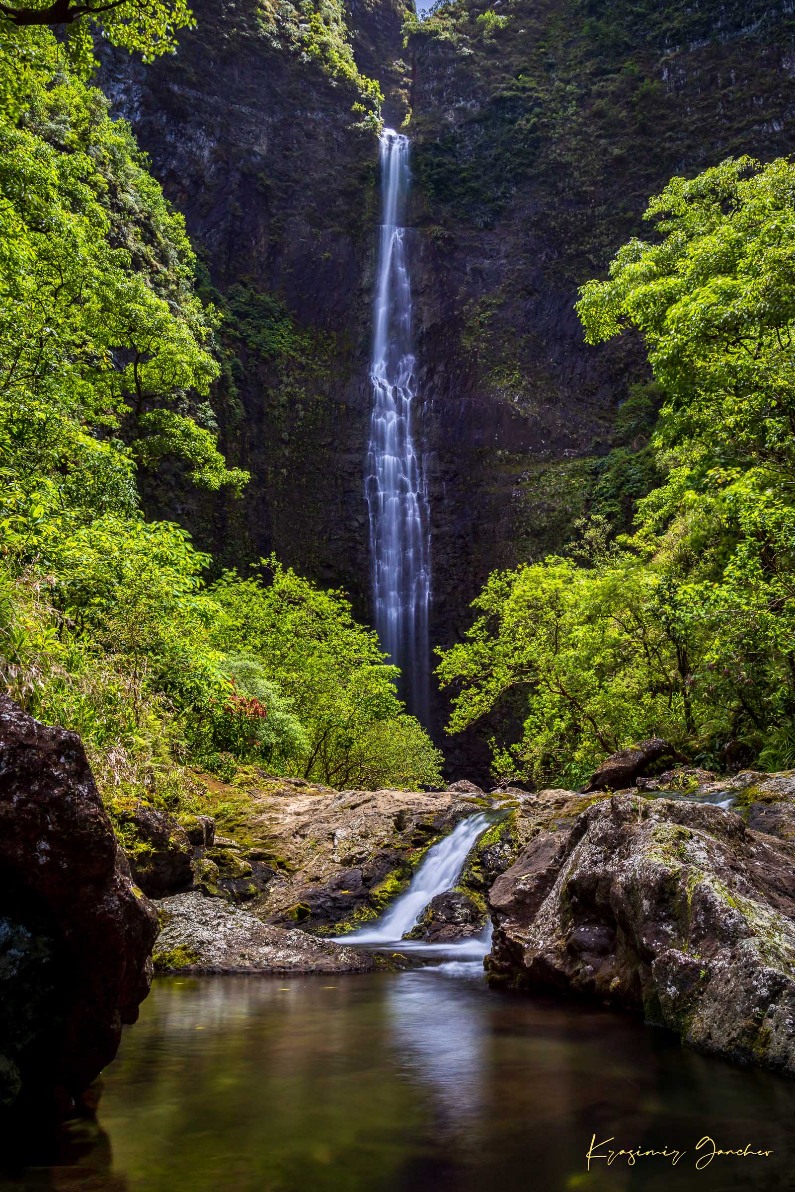 Small waterfall veiled in mist beneath dense foliage at Hanakapiai Falls, Kauai, lit by daylight. #Finish_Acrylic Recess