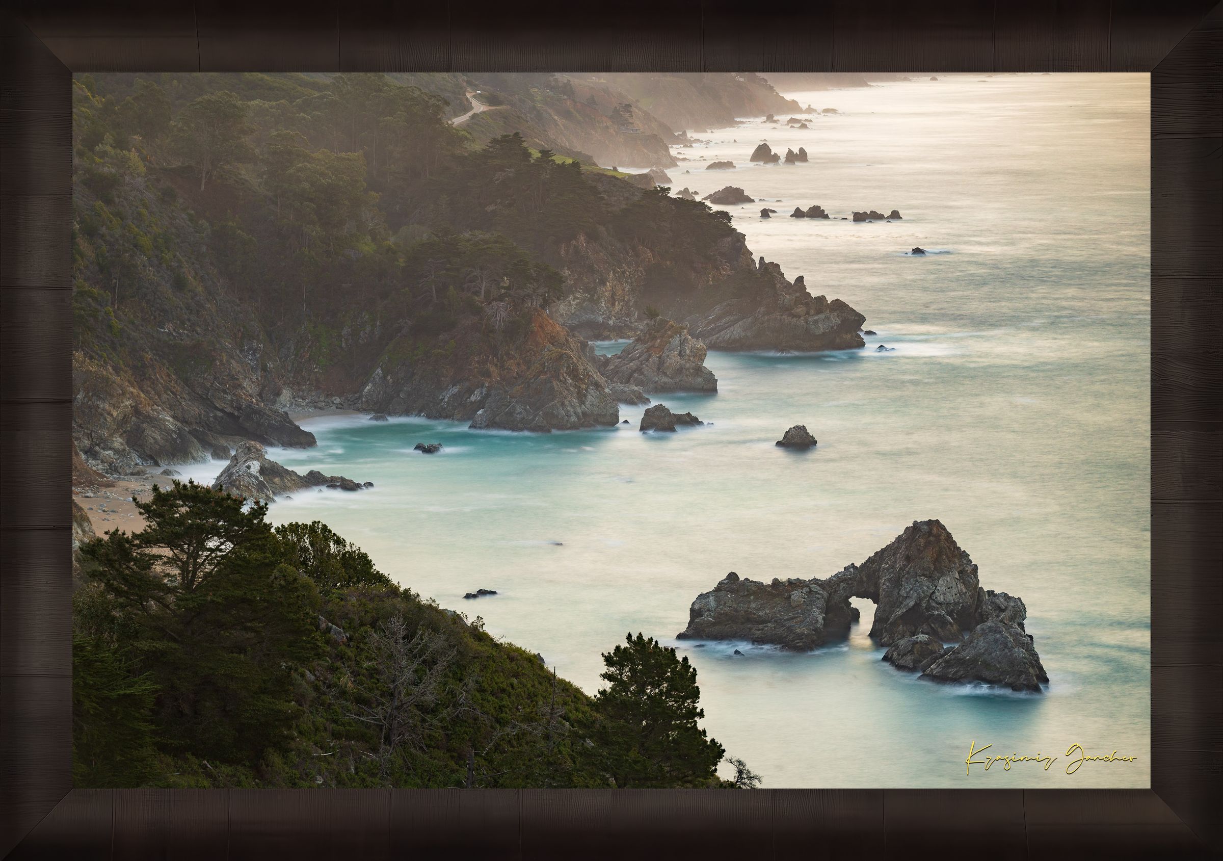 Coastal rock formation known as McWay Rocks at dawn on the Big Sur coastline with lush vegetation and ocean view. #Finish_Roma Dark Ash Frame