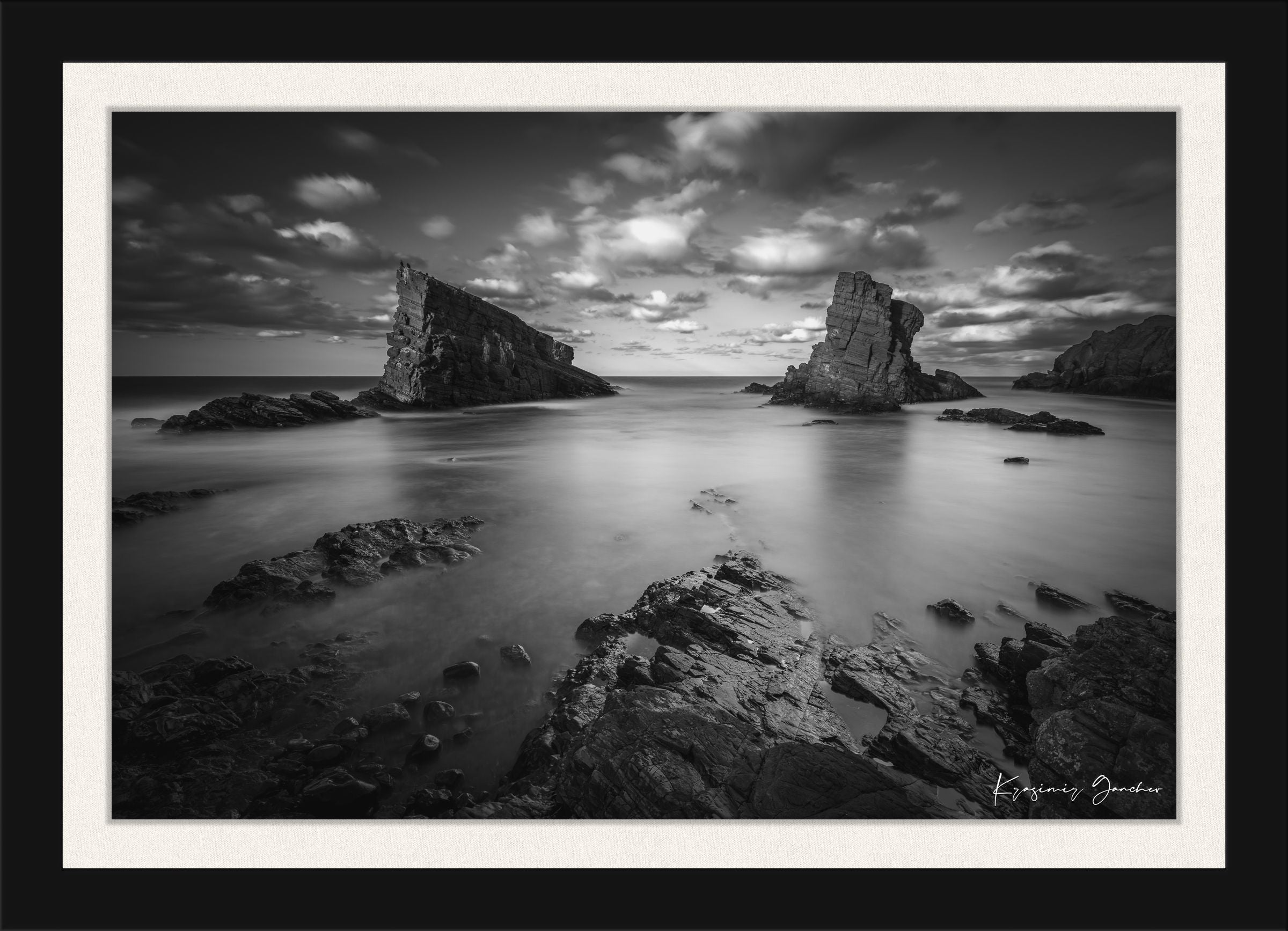 The Stone Ships rock formations at Sinemorets, Bulgaria, captured in black and white during a sunset with clouds over the sea. #Finish_Roma Satin Black Frame & Bright Liner